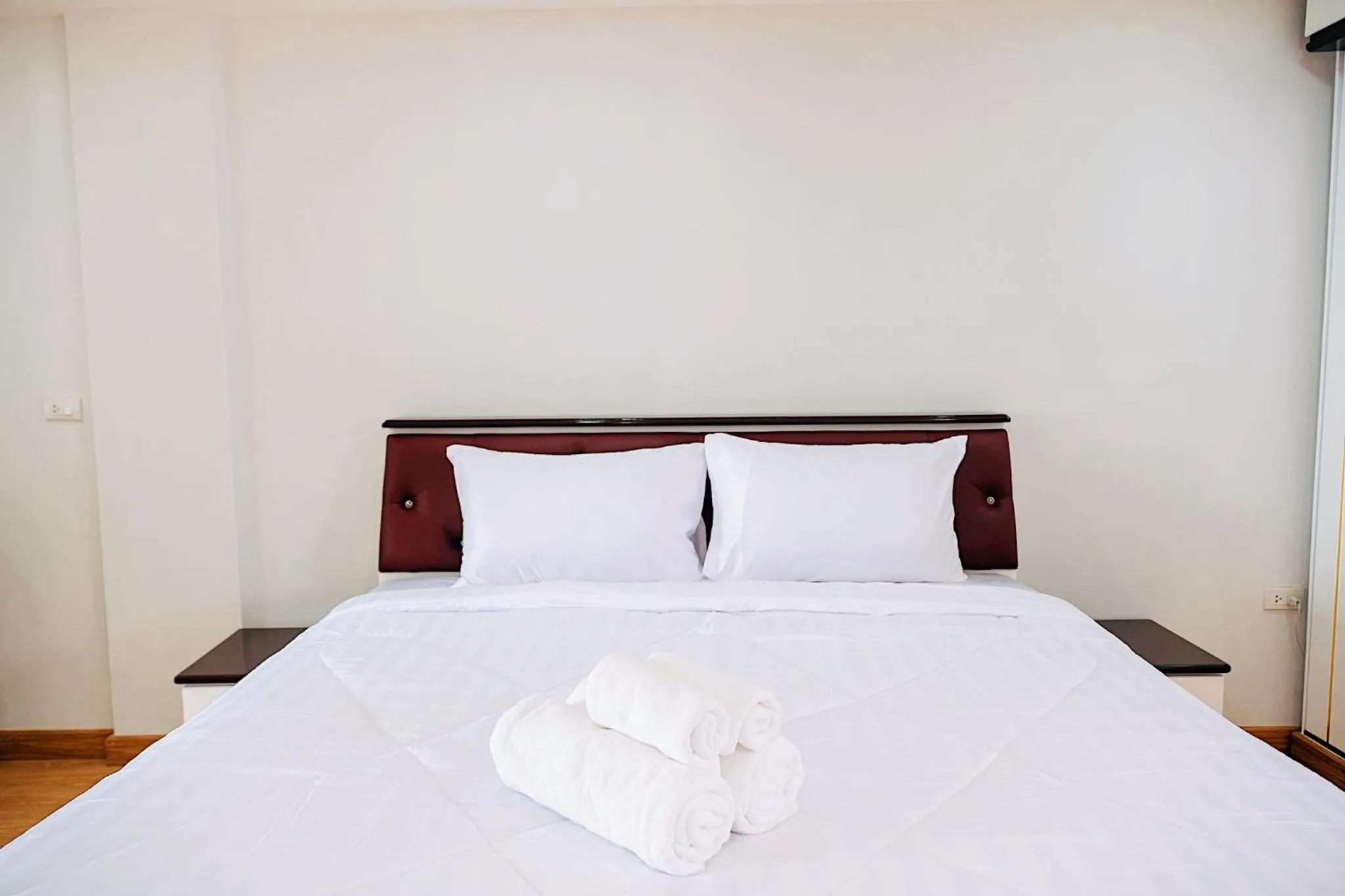 Bed in PT Grand Hotel