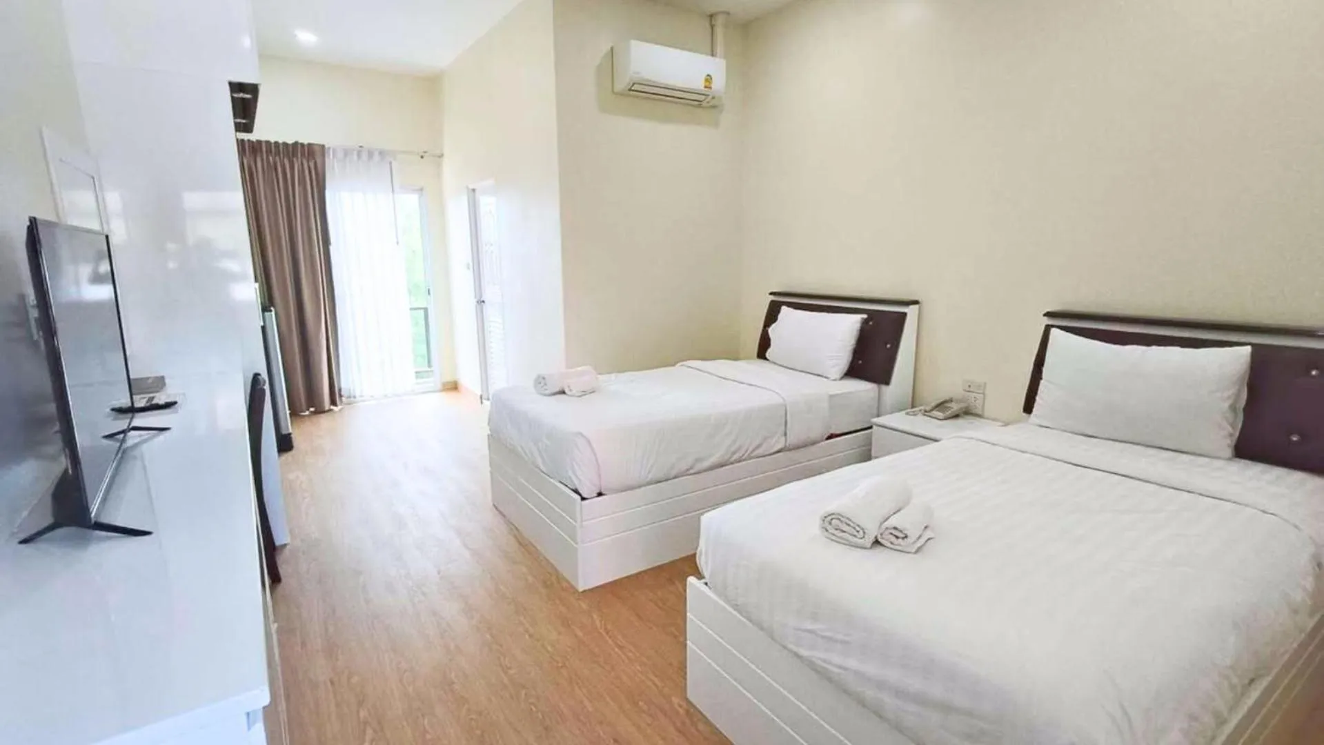 Bed in PT Grand Hotel