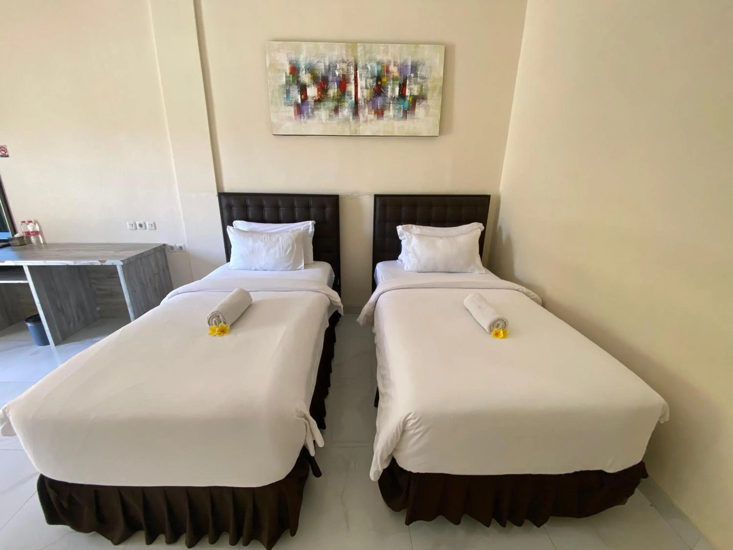 Bed in THE LAVIANA HOTEL