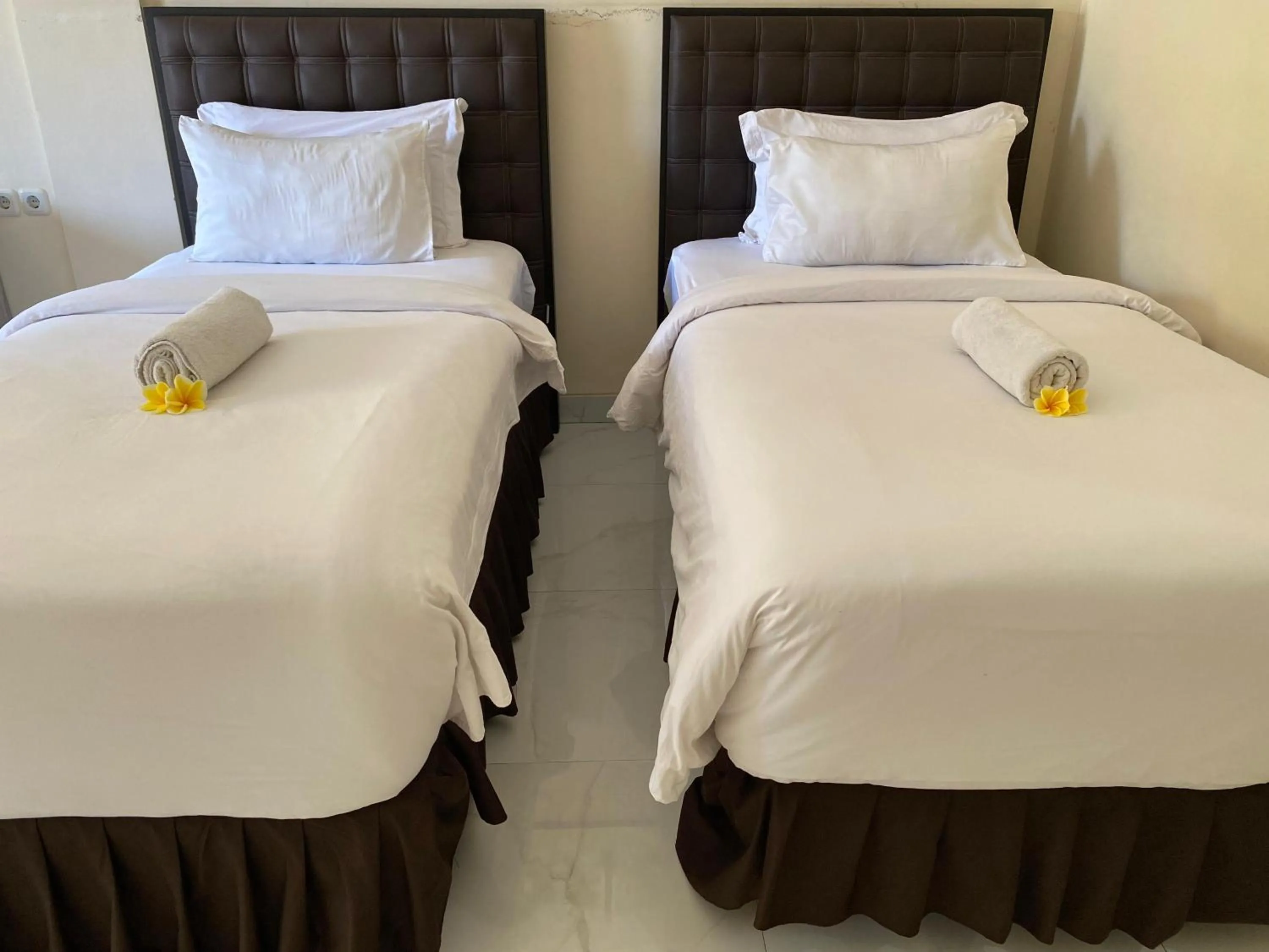 Bed in THE LAVIANA HOTEL