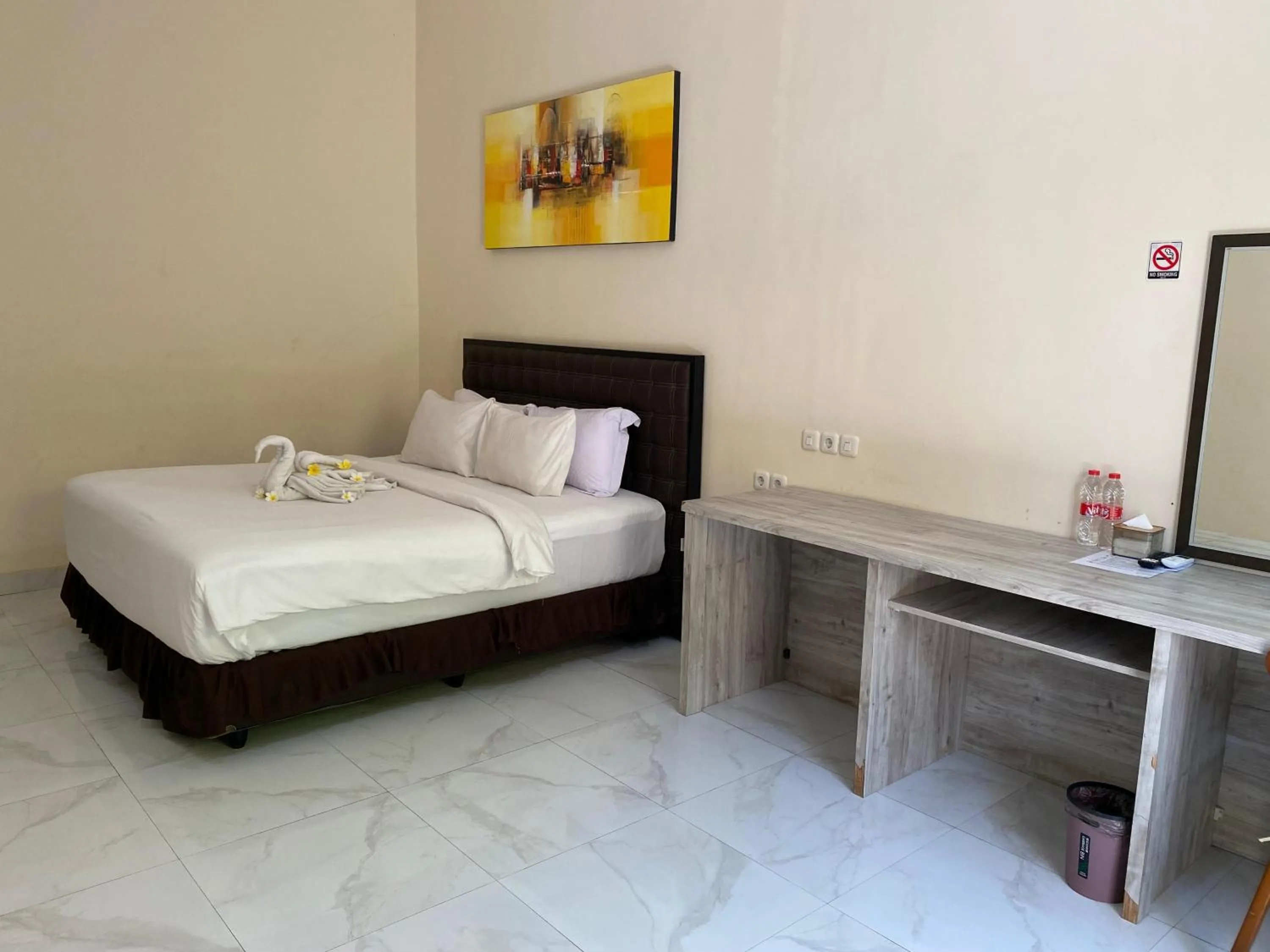 Bed in THE LAVIANA HOTEL