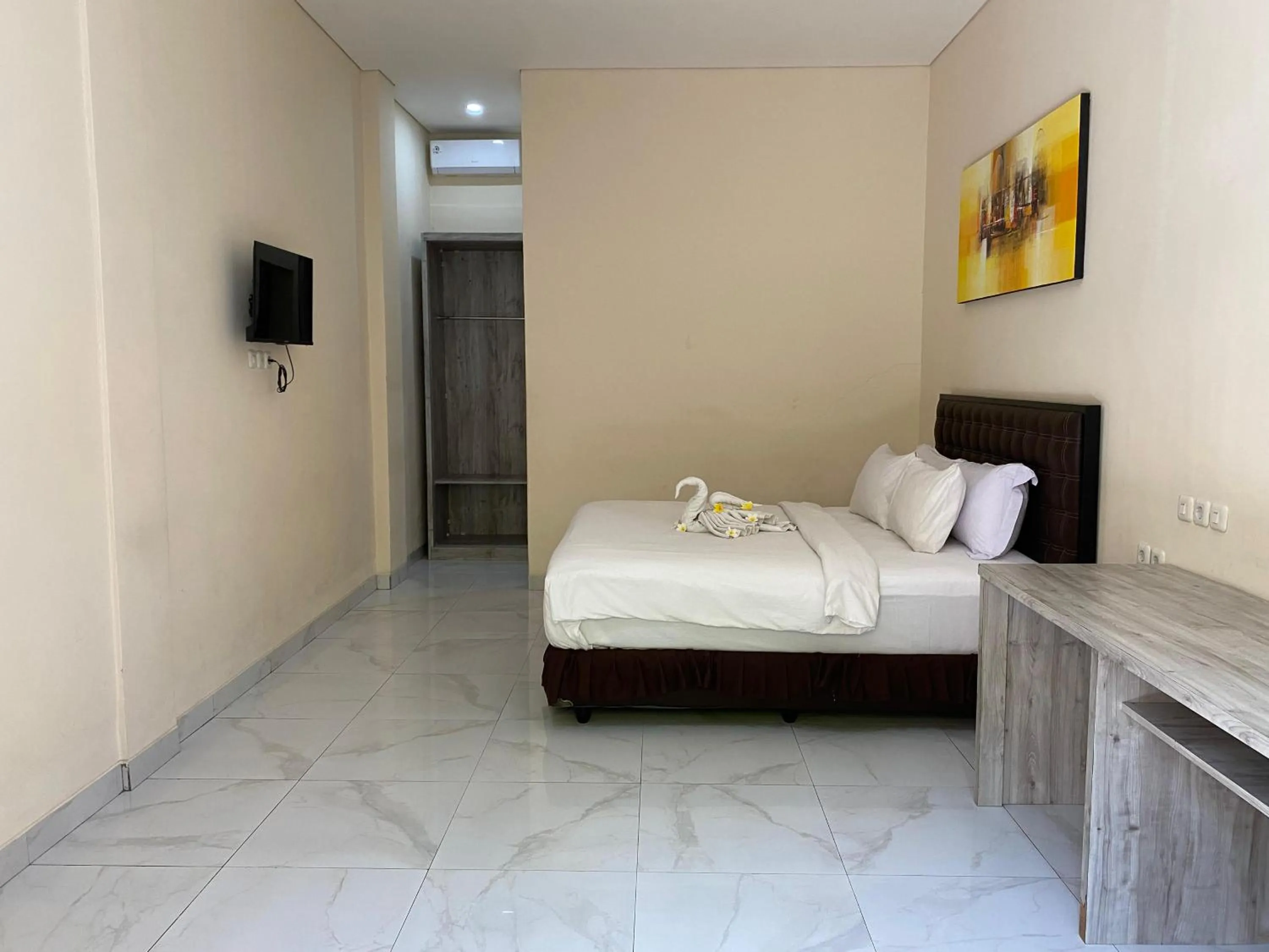 Bed in THE LAVIANA HOTEL