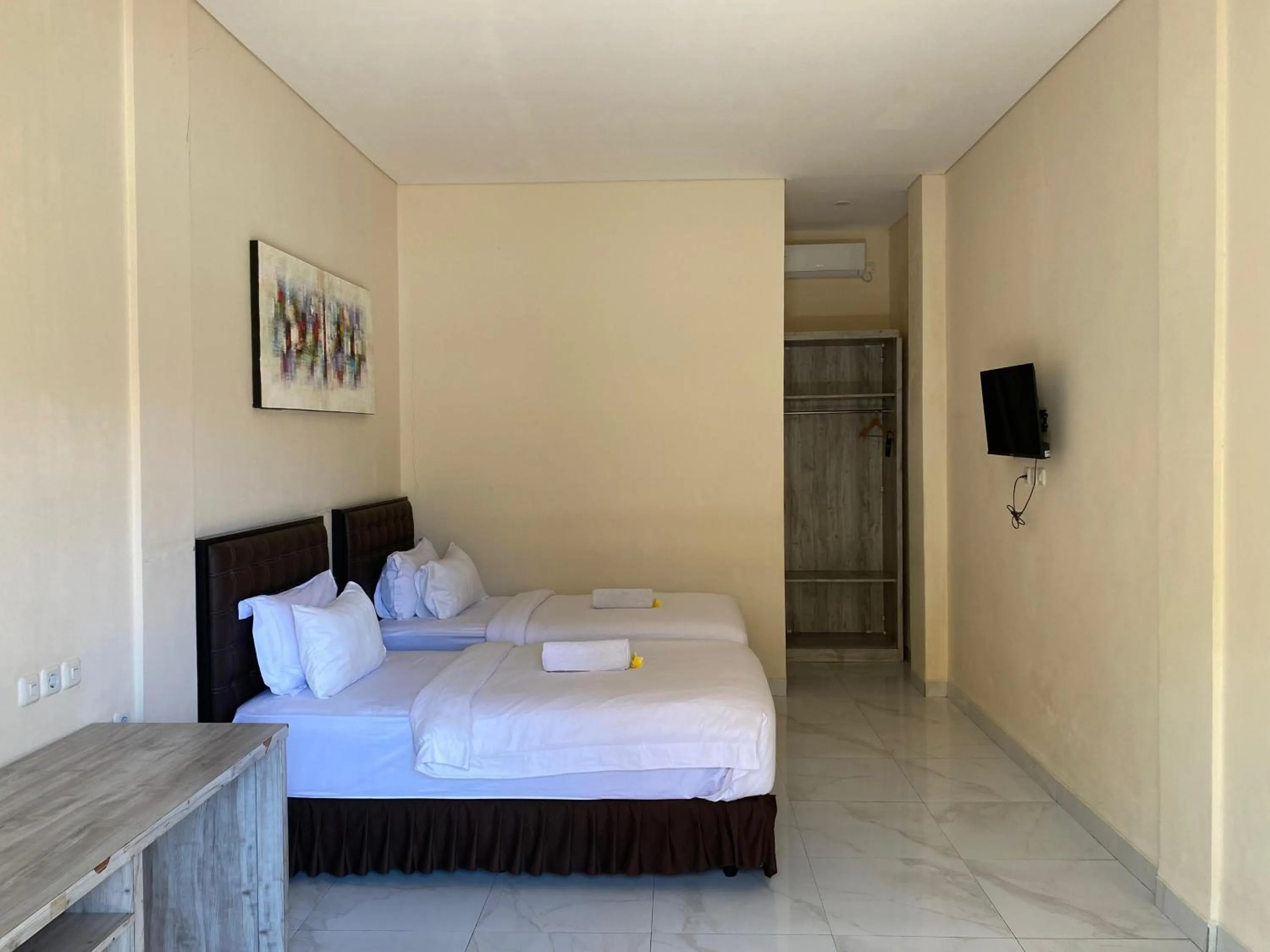 Bed in THE LAVIANA HOTEL