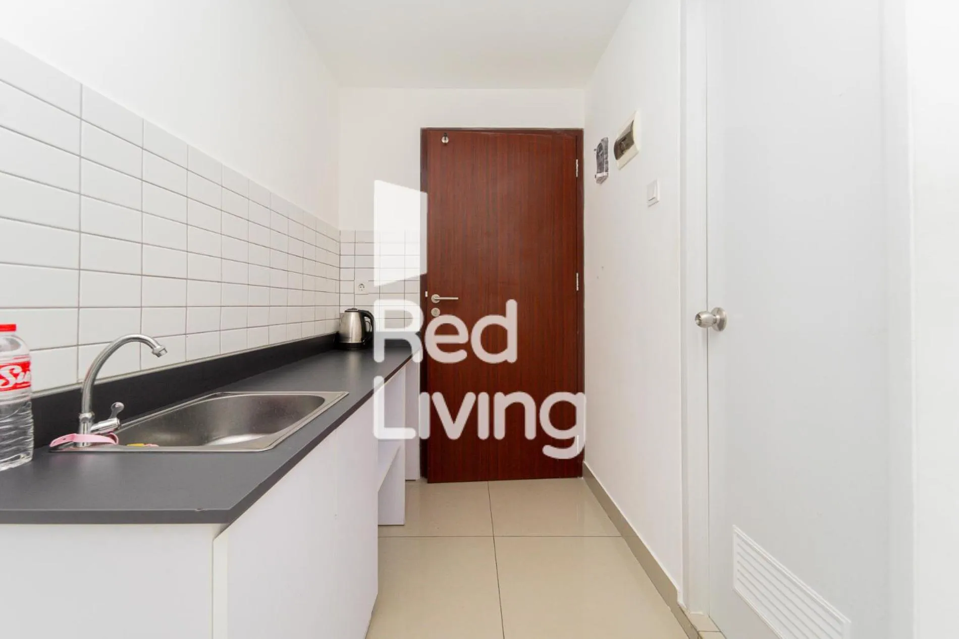 Kitchen or kitchenette in RedLiving Apartemen Sayana - Sentra Jaya