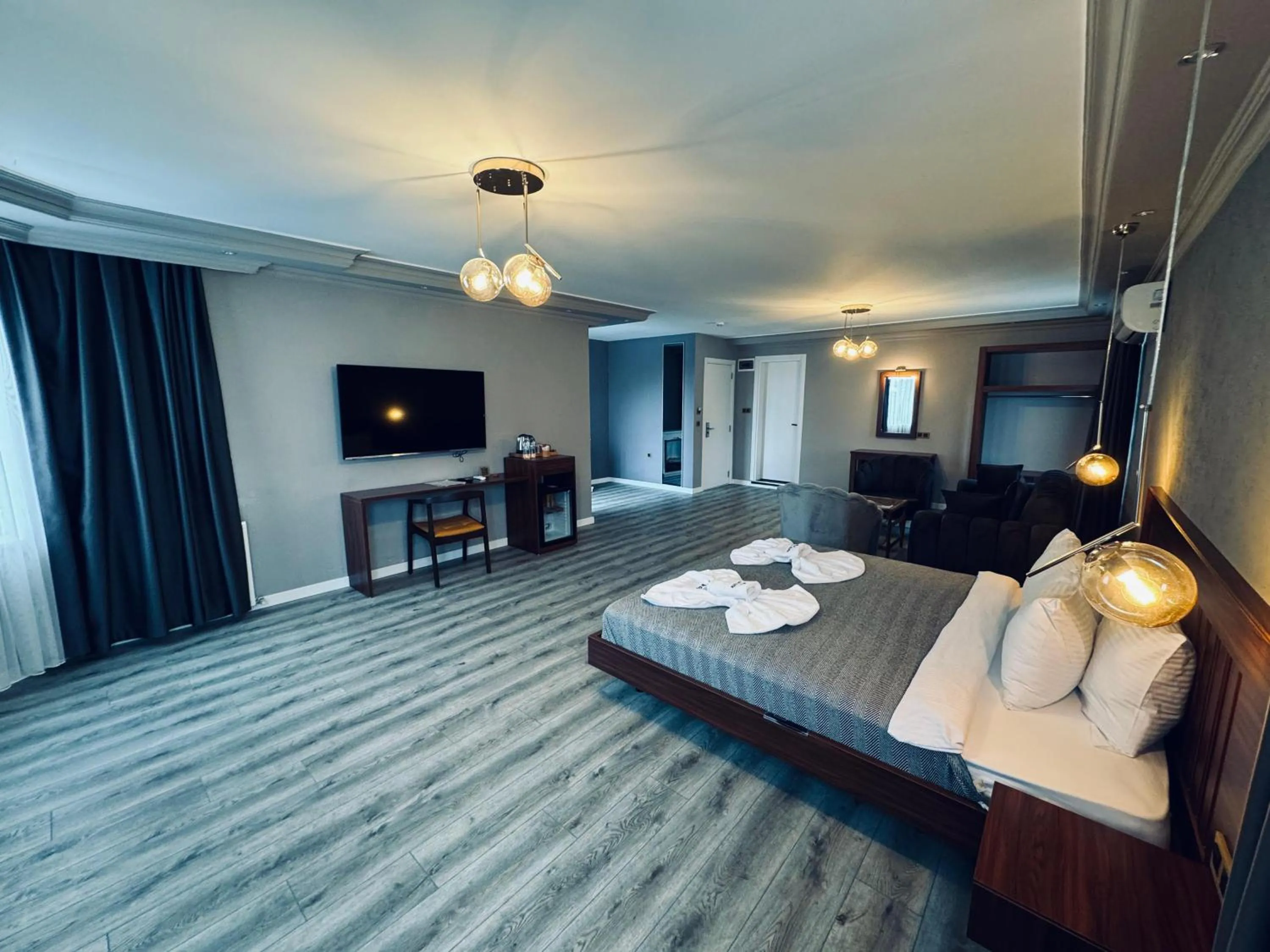 Communal lounge/ TV room, Bed in Istanbul Airport Treekos Suite Hotel