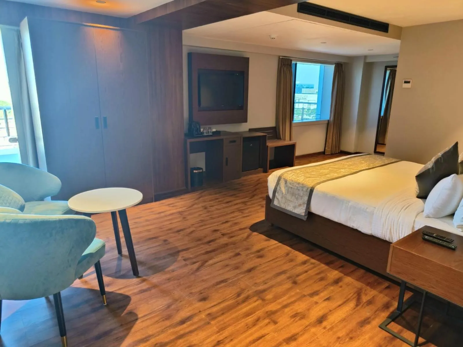 Photo of the whole room, Bed in Ramee International Surat