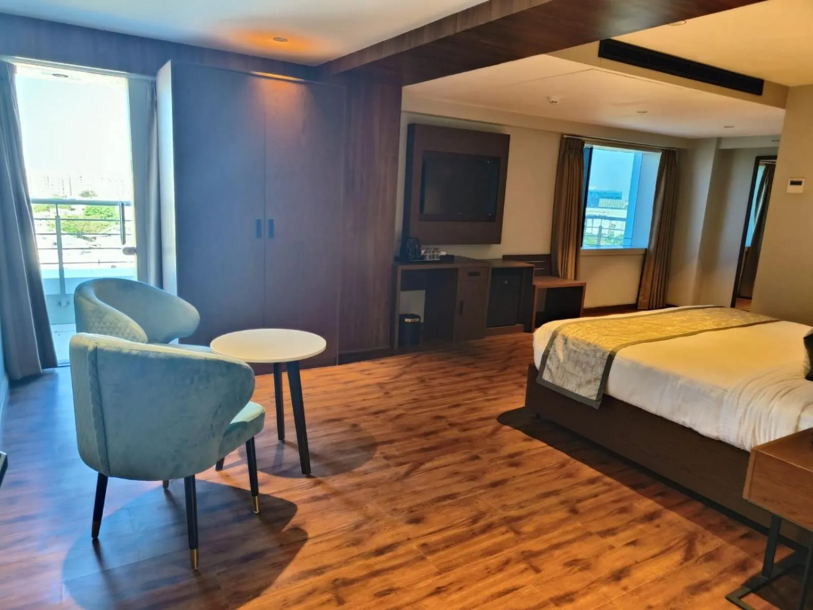 Seating area, Bed in Ramee International Surat