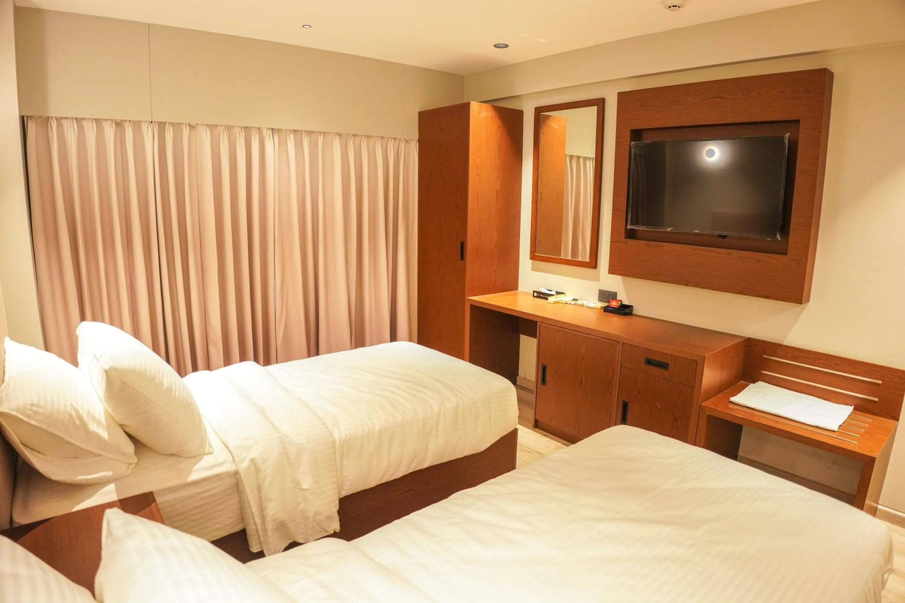 Bed in Ramee International Surat