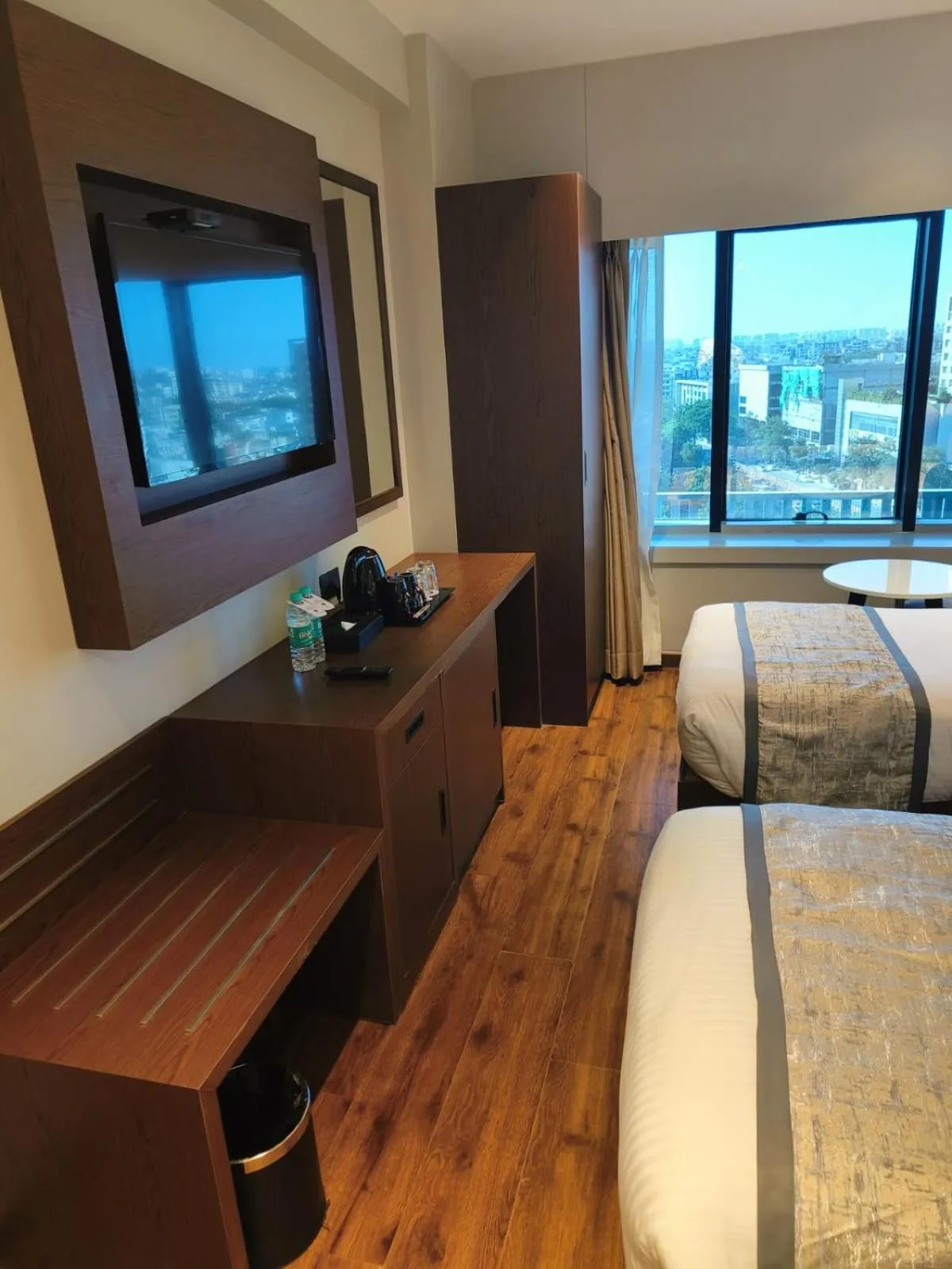 Seating area, Bed in Ramee International Surat