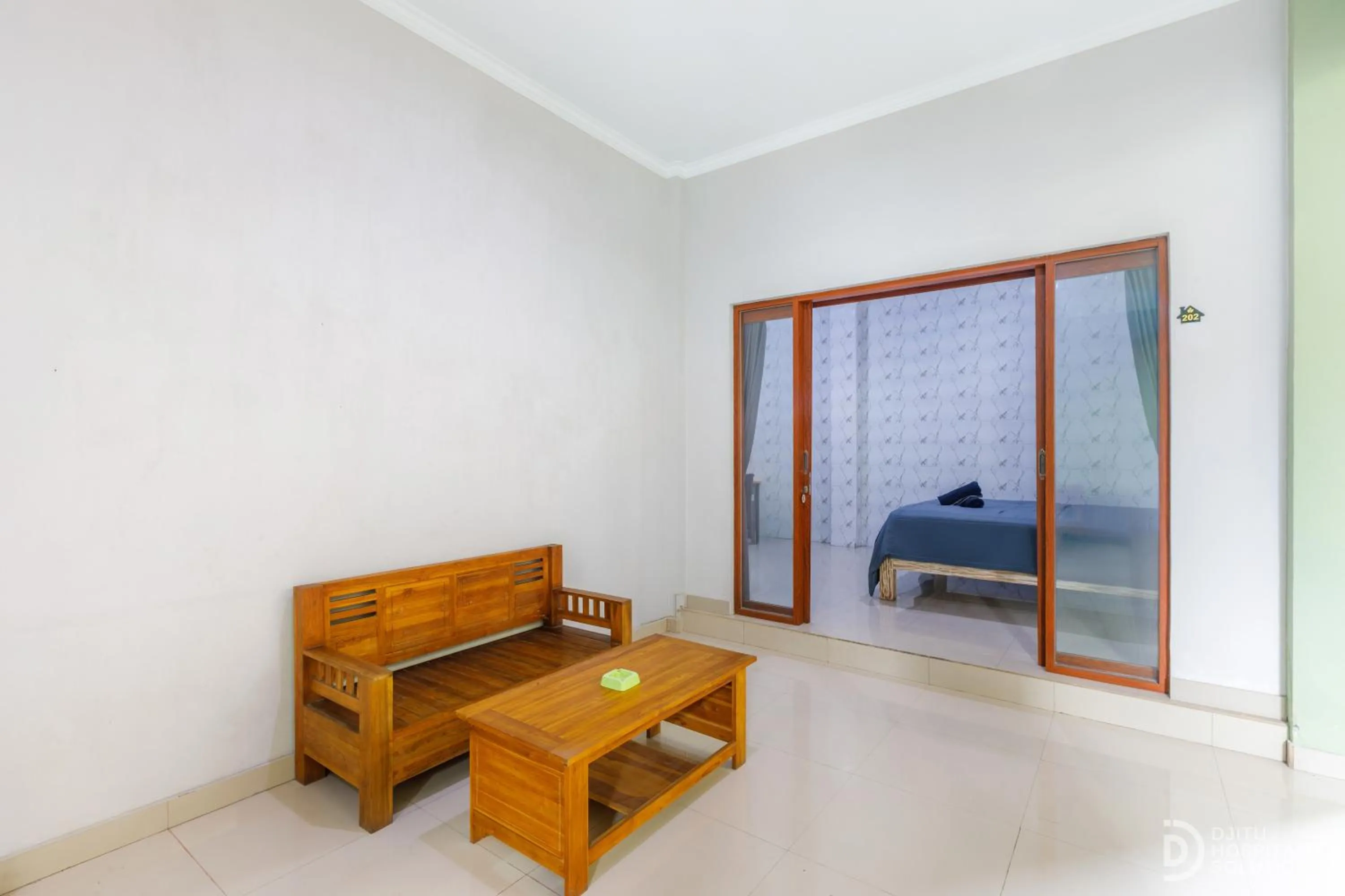 Seating area, Bed in Bali DD homestay seminyak