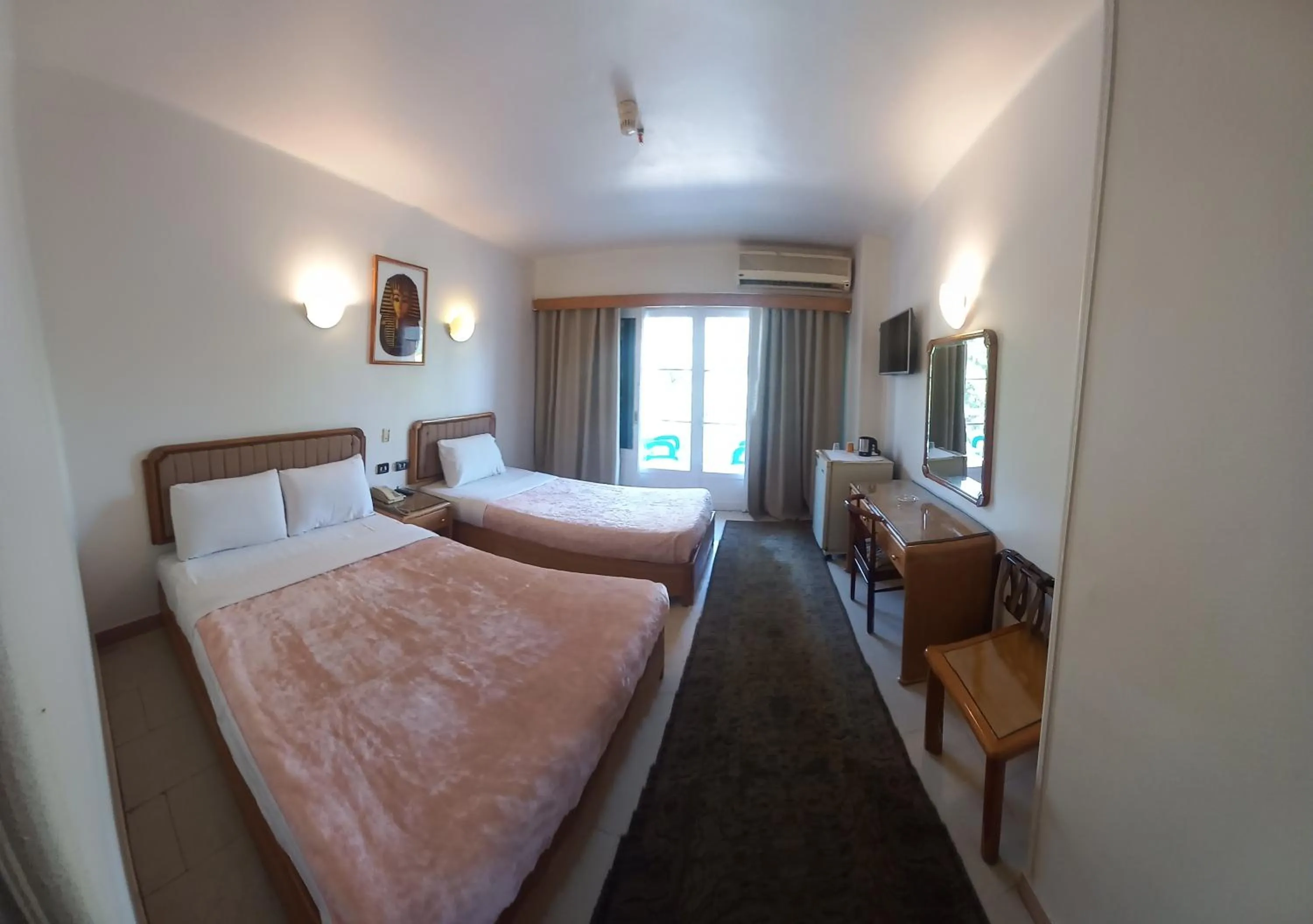 Photo of the whole room, Bed in New Pola Hotel