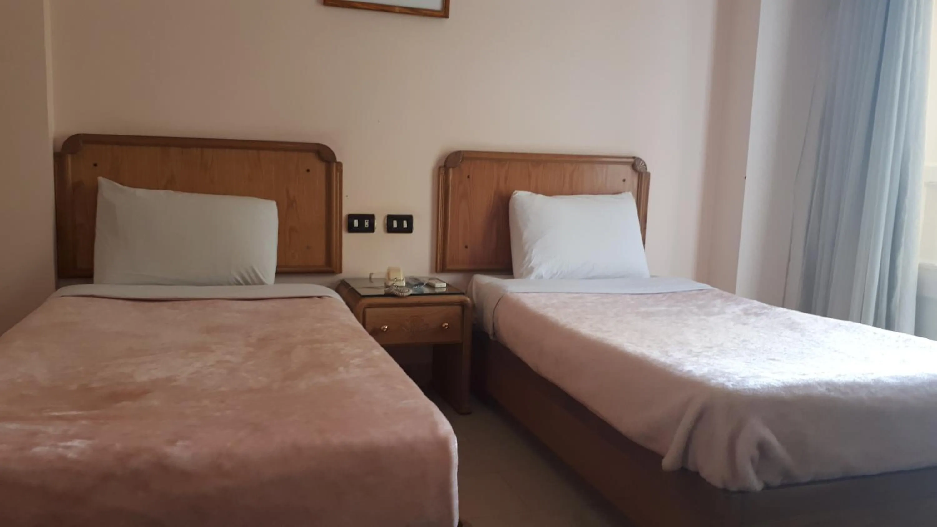 Bed in New Pola Hotel