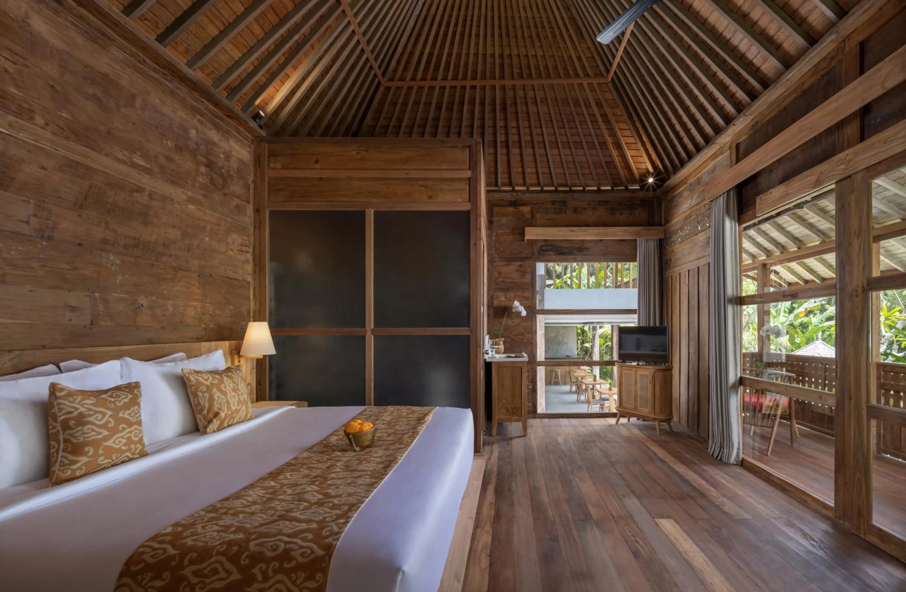 Bed in RUMAH KAYU RESORT