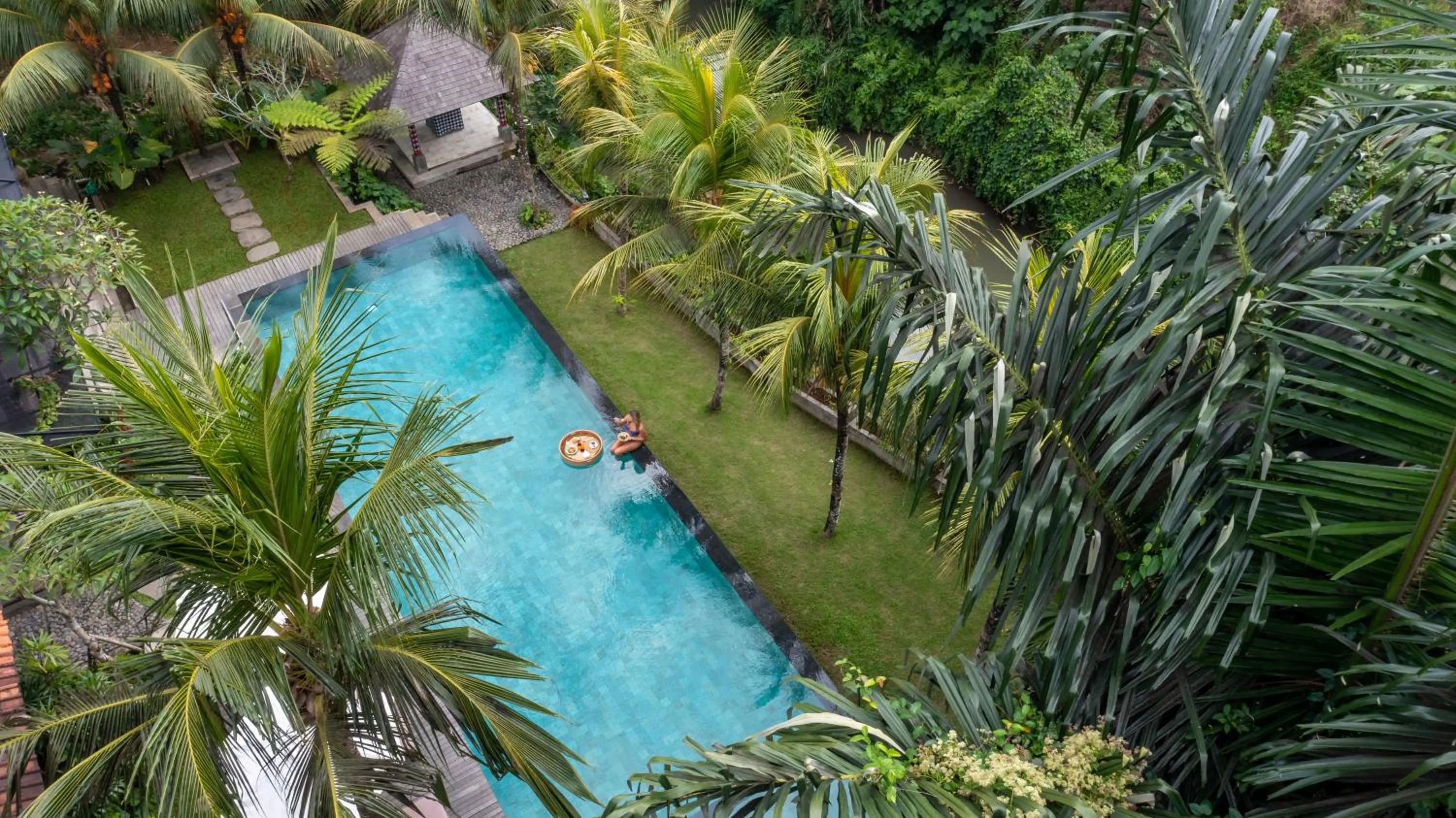 Swimming pool in RUMAH KAYU RESORT