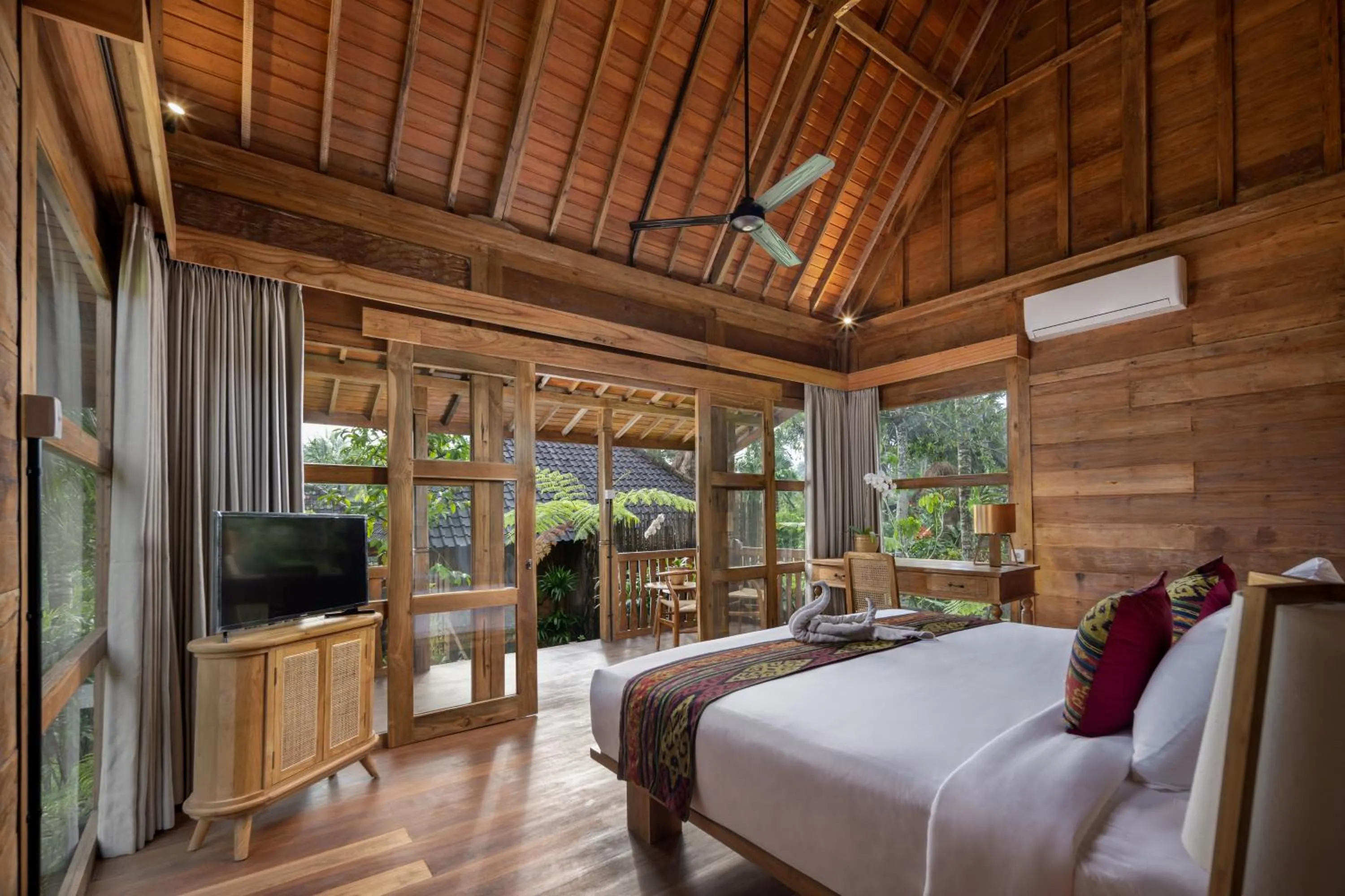 Bed in RUMAH KAYU RESORT