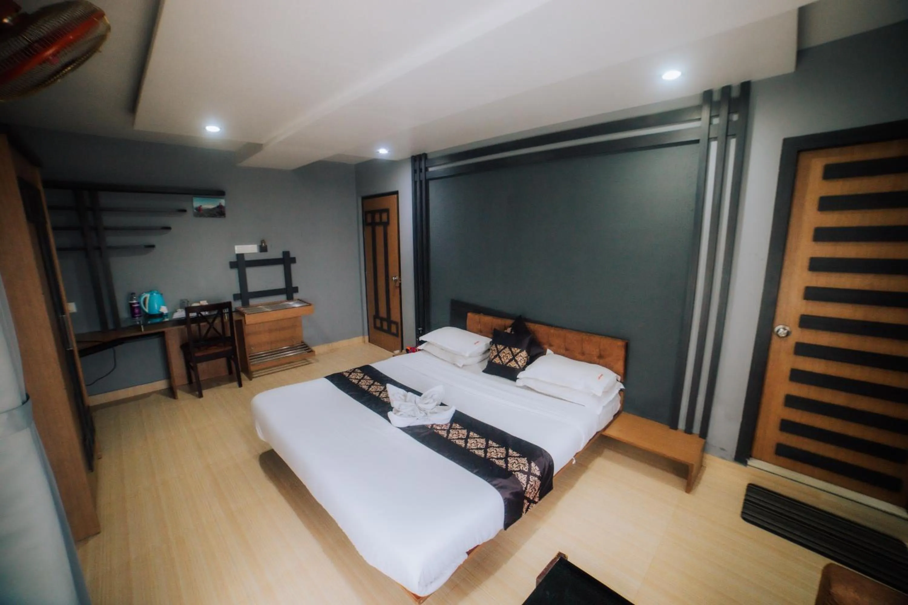 Bed in Amarjeet Hotel