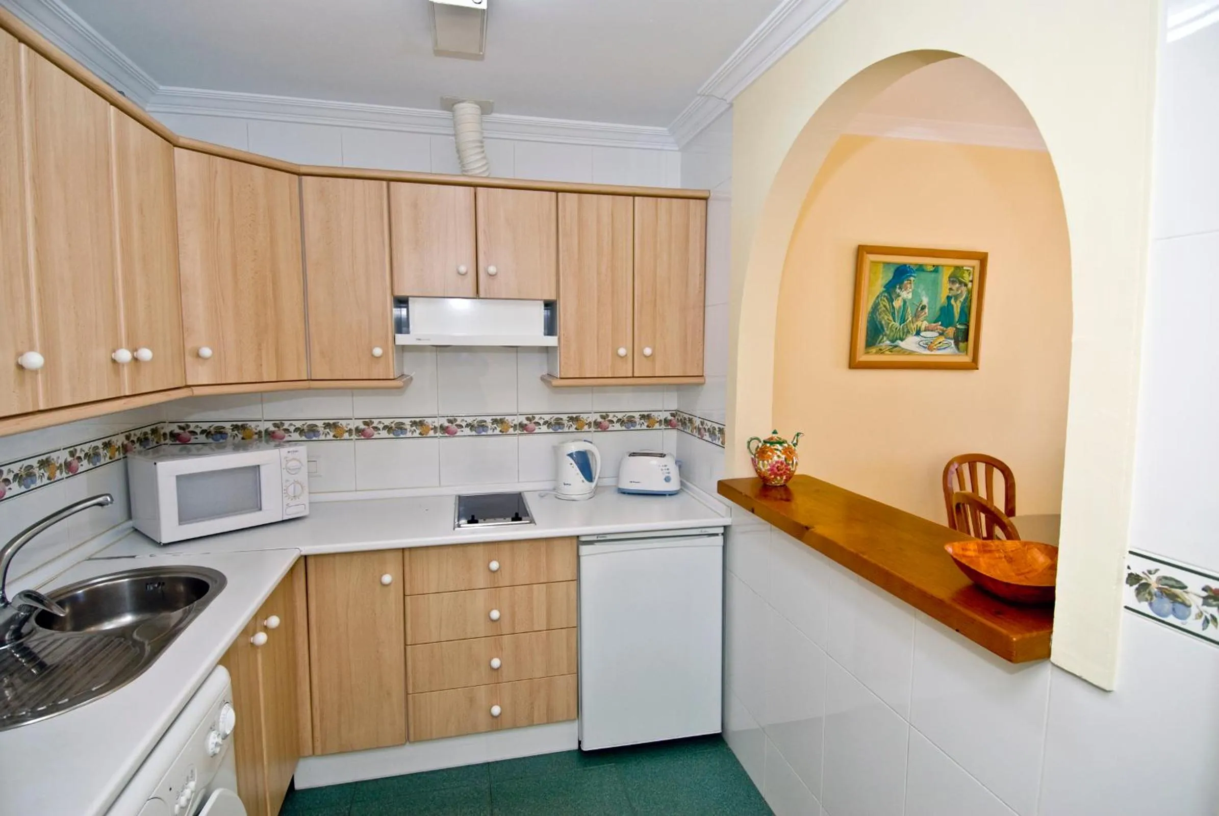 Kitchen or kitchenette in Apartamentos HC Burriana Playa
