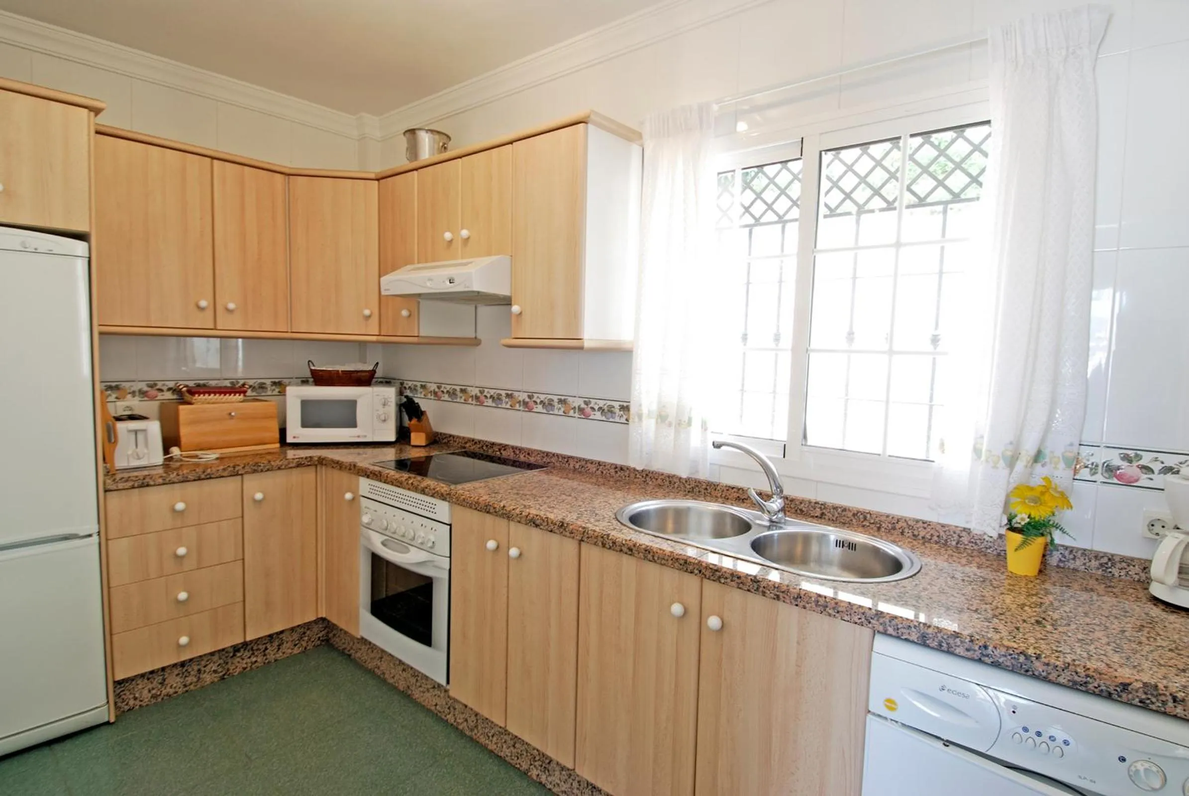 Kitchen or kitchenette in Apartamentos HC Burriana Playa