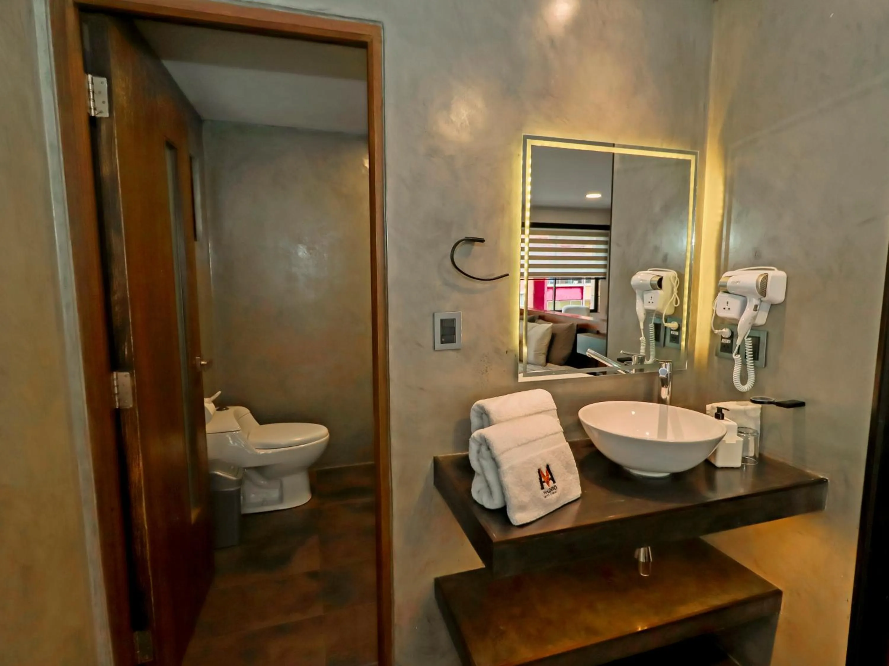 Toilet in Madero Hotel & Suites