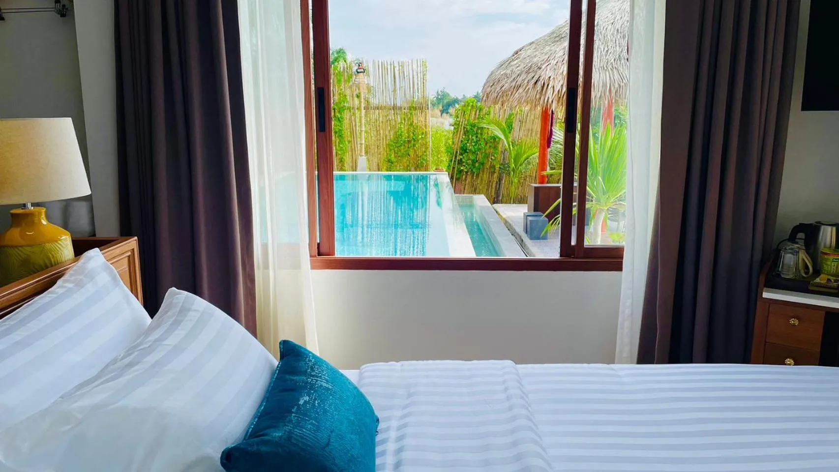 Pool view, Bed in Canal Village Pakpra Phatthalung