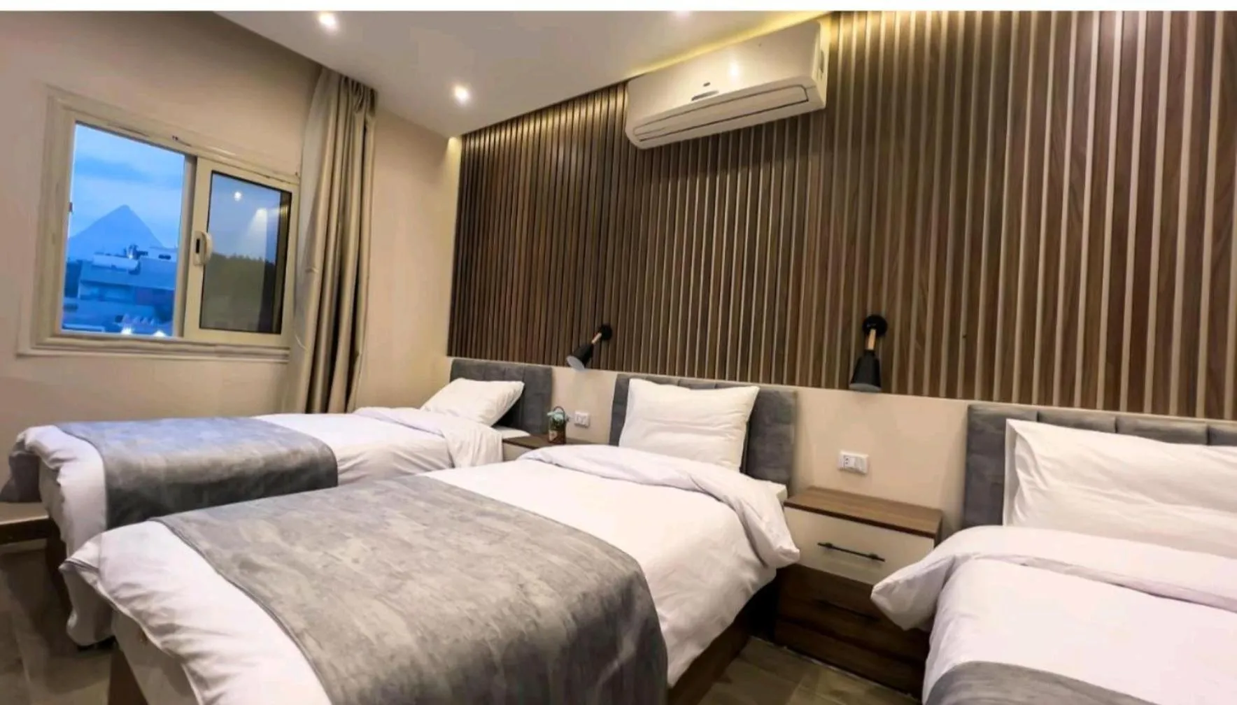 Photo of the whole room, Bed in STEPS IN Pyramids View