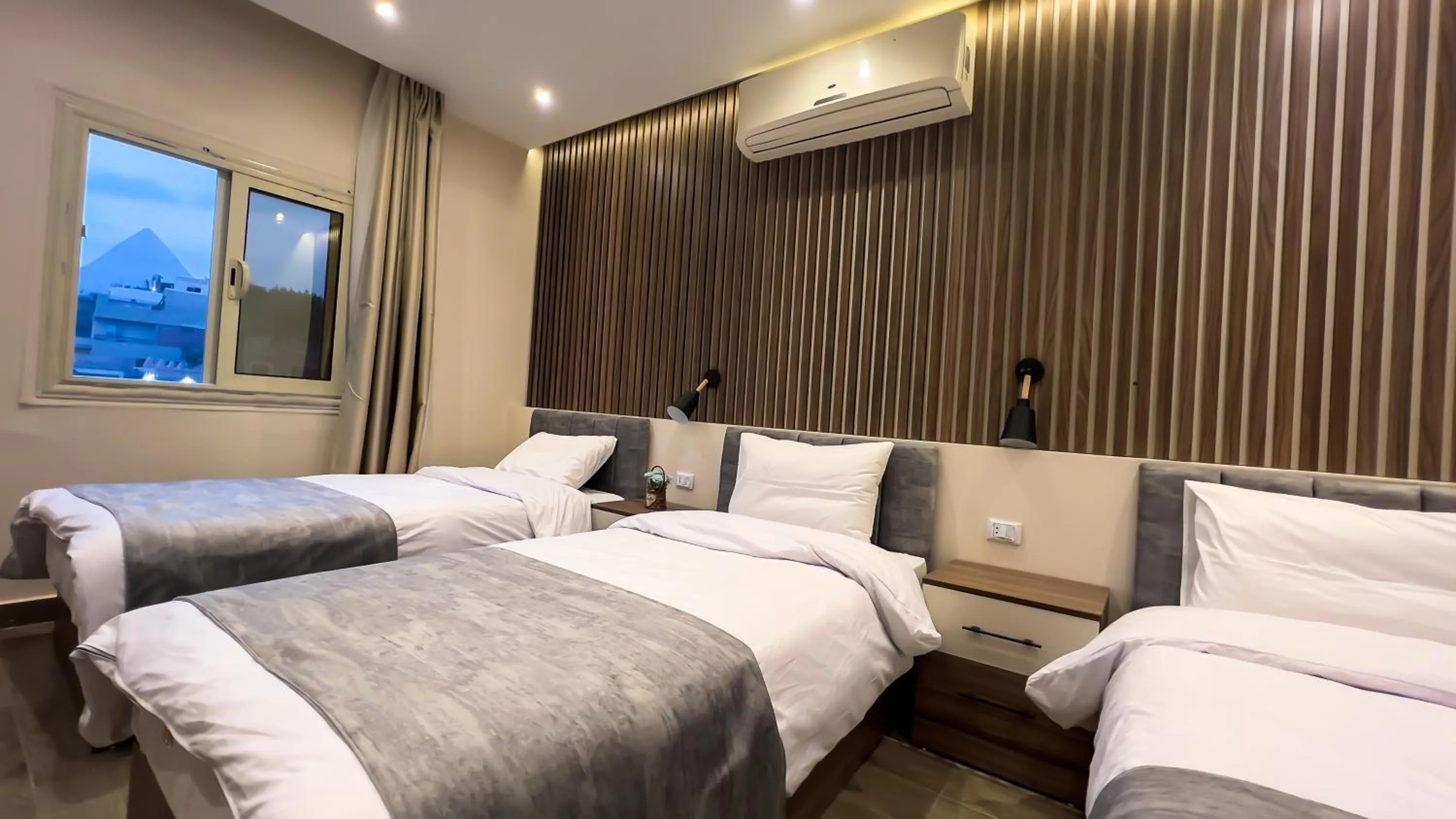 Photo of the whole room, Bed in STEPS IN Pyramids View