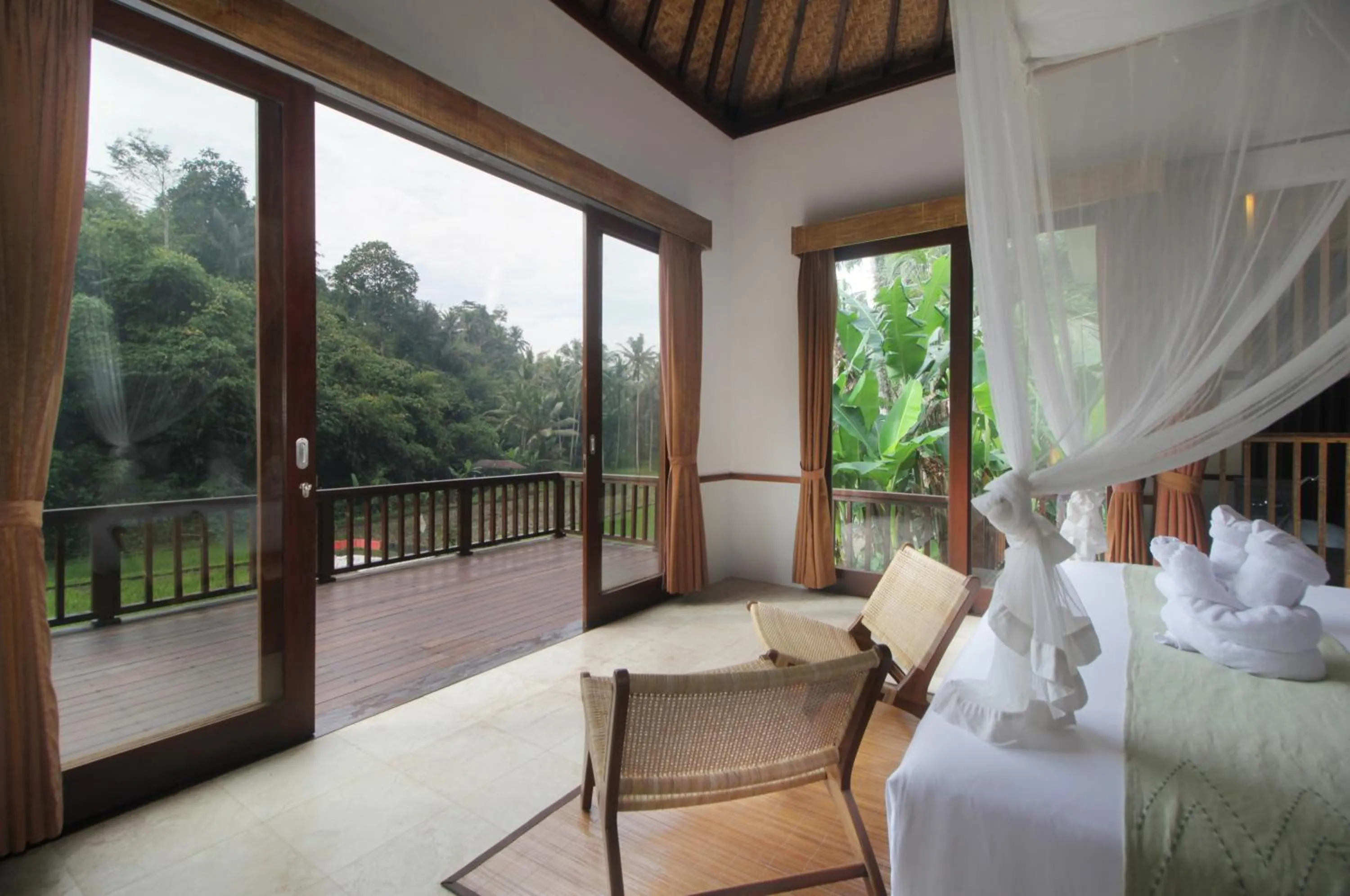 Bed in The Tirta Sari Villas