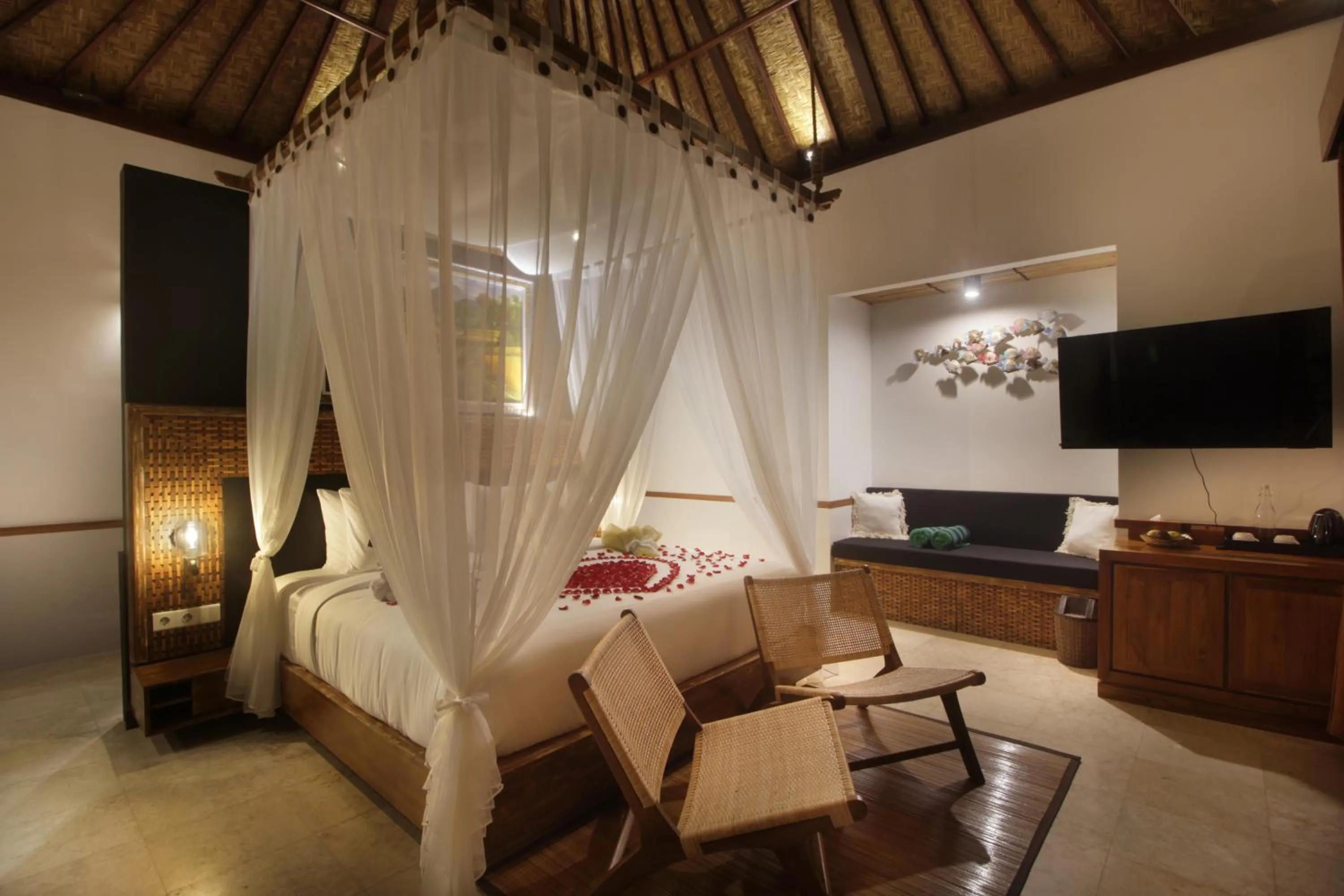 Bed in The Tirta Sari Villas