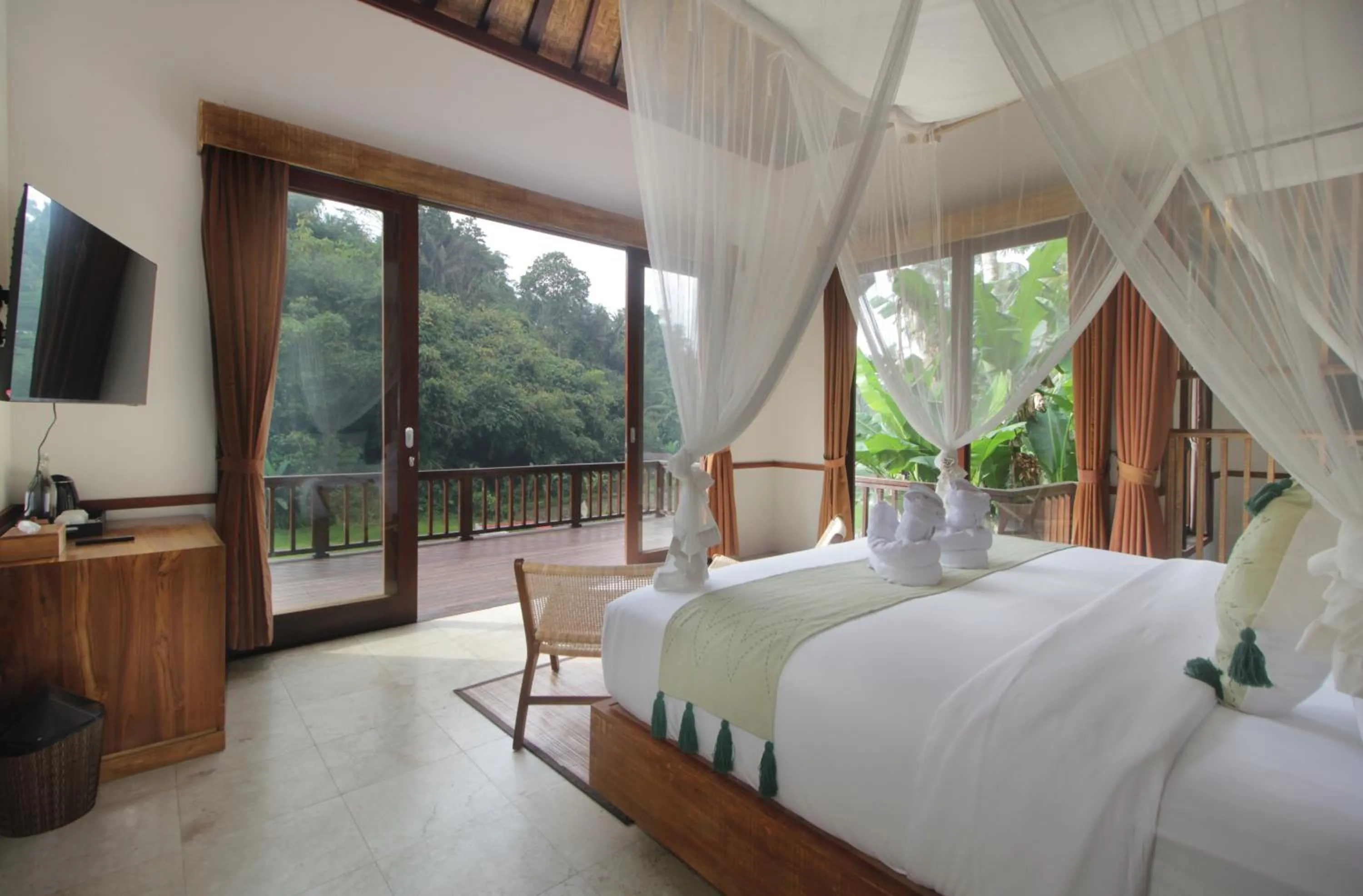 Bed in The Tirta Sari Villas