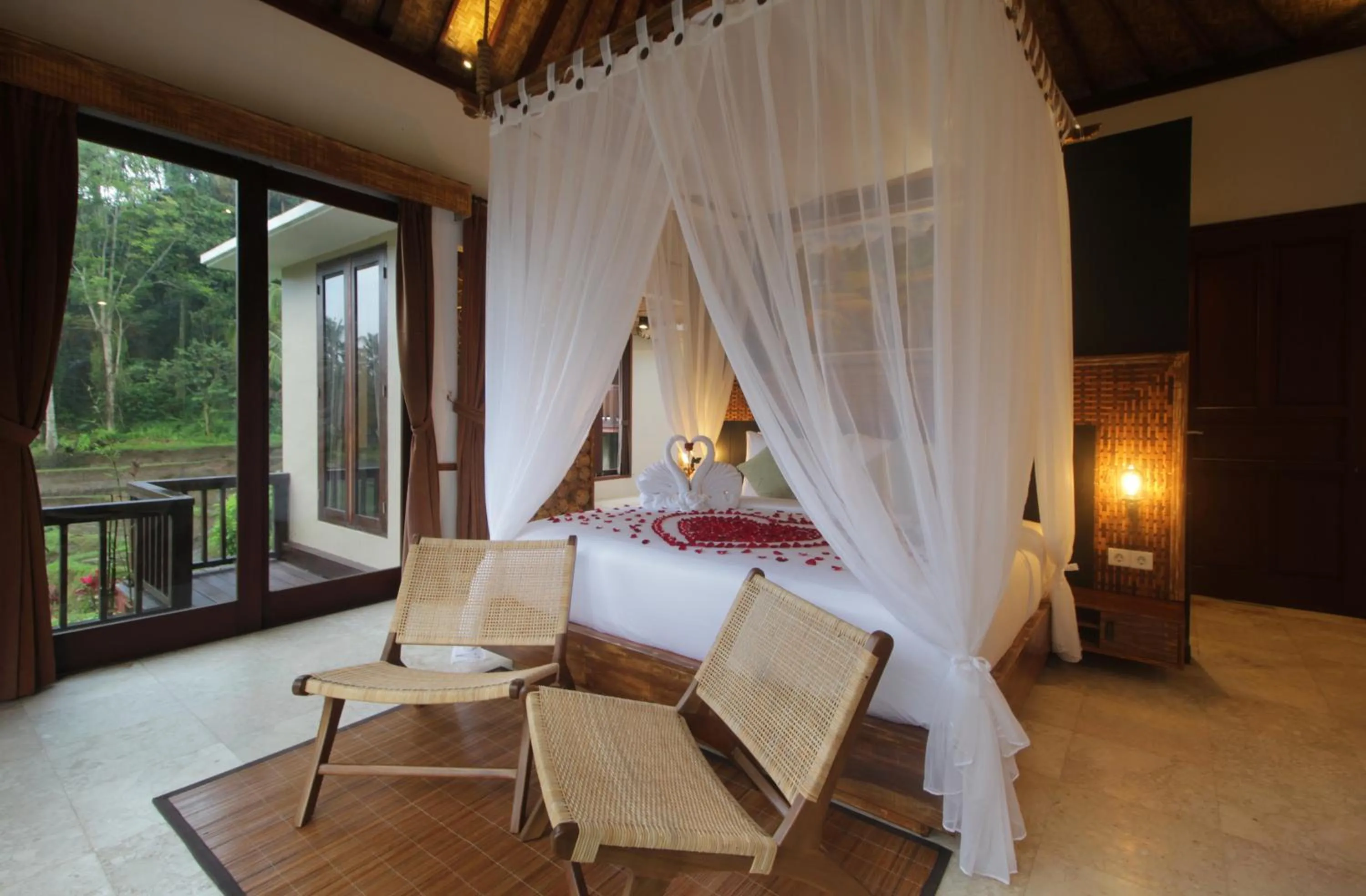 Bed in The Tirta Sari Villas