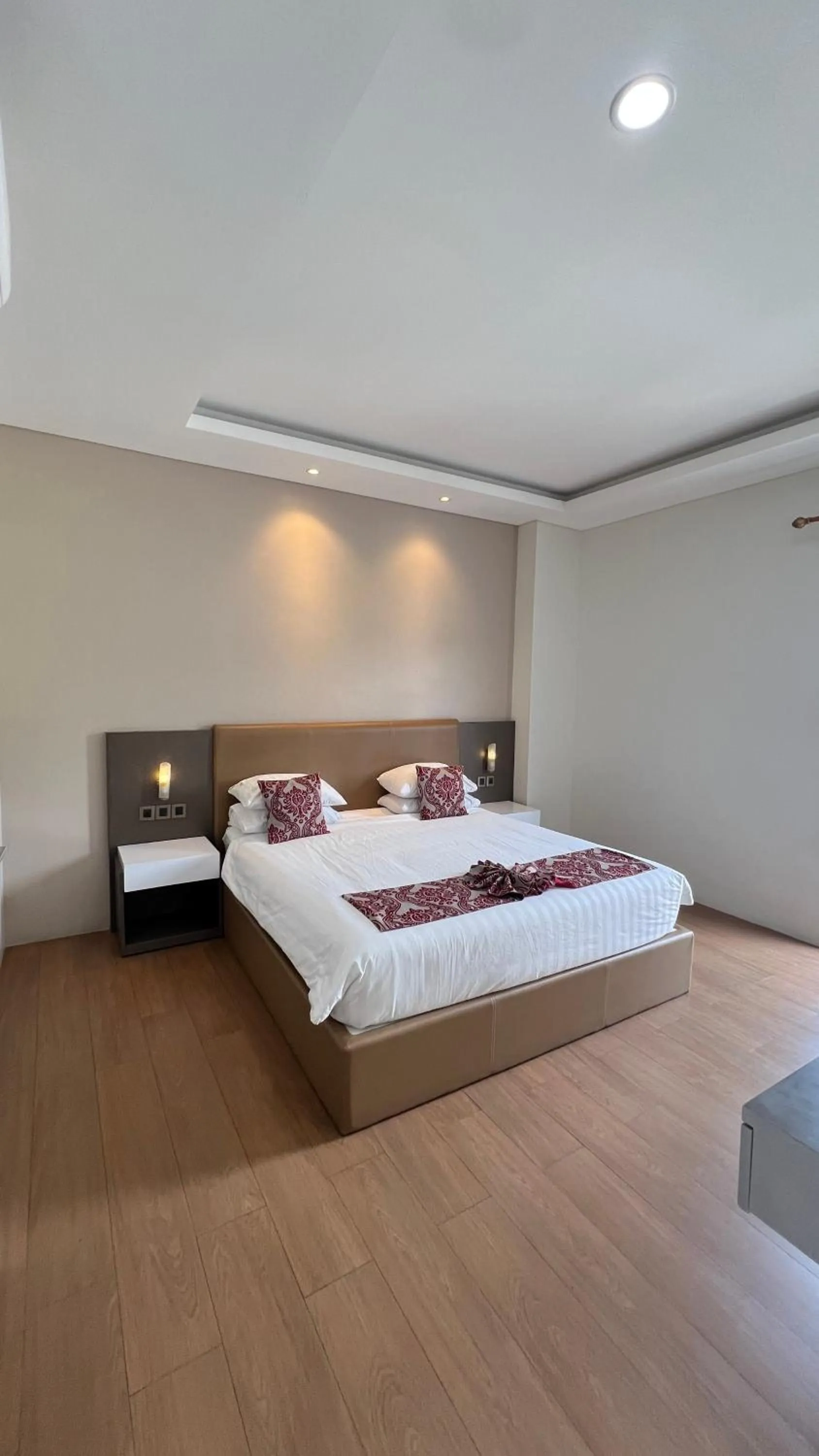 Bed in PURNAMA BALIGE HOTEL