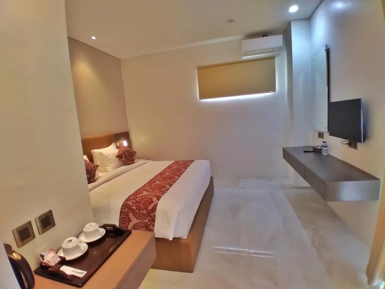 Bed in PURNAMA BALIGE HOTEL