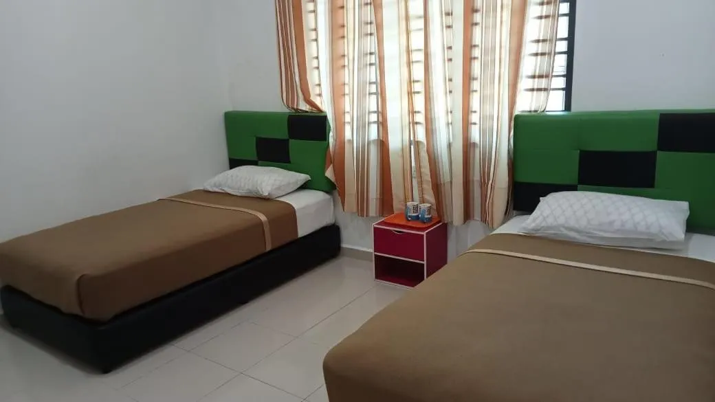Bed in DLAYARAN VILLA GUEST HOUSE