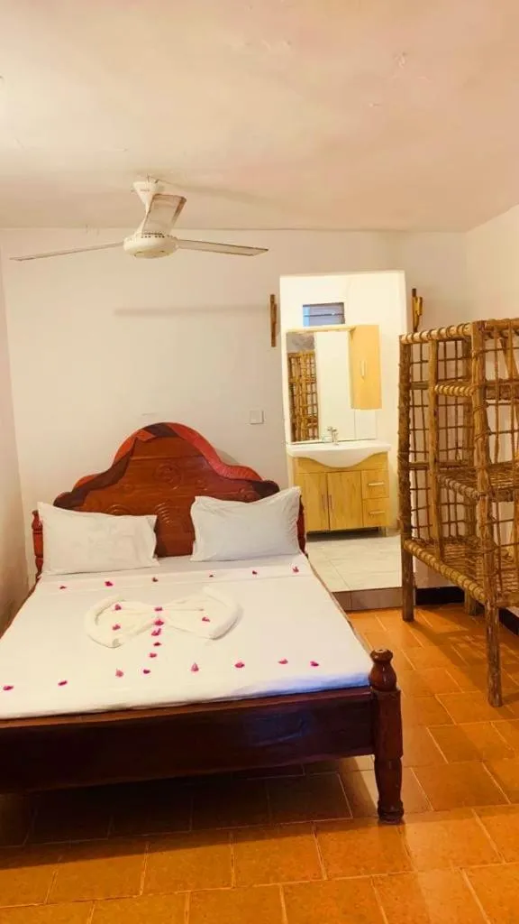 Bed in Sipano Beach Lodge Kiwengwa