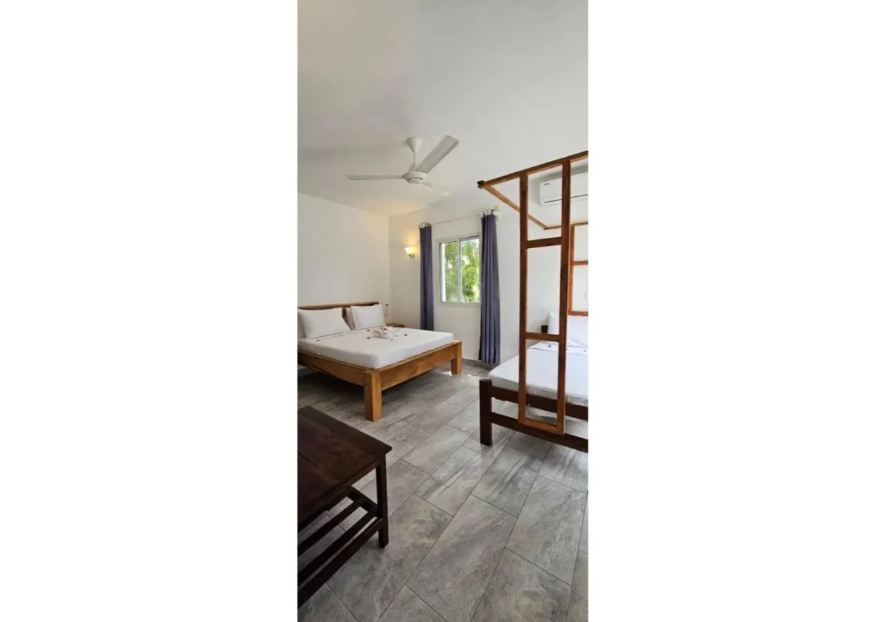 Bed in Sipano Beach Lodge Kiwengwa