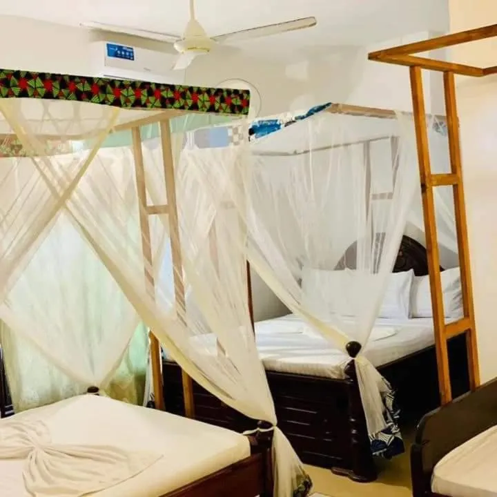 Bed in Sipano Beach Lodge Kiwengwa
