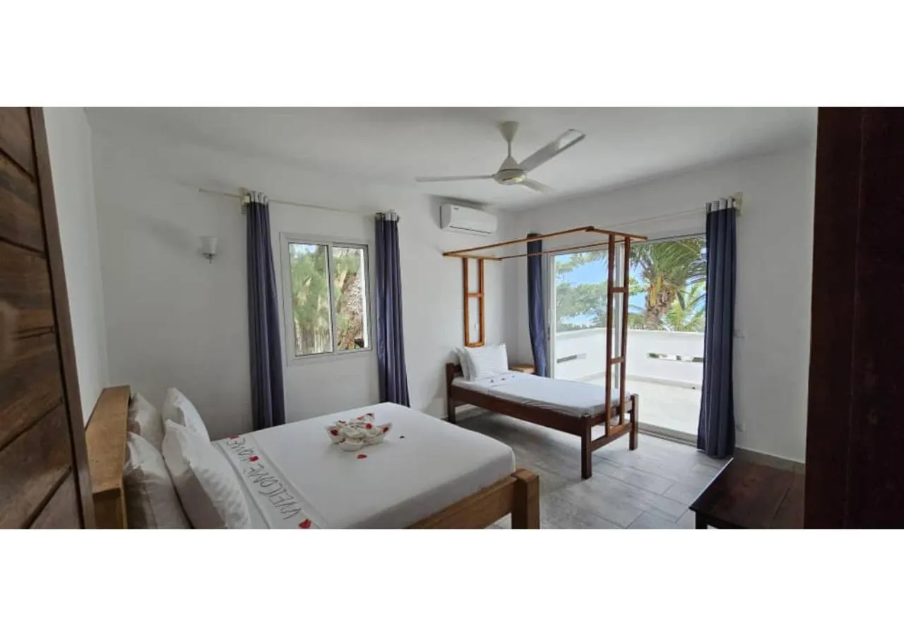 Bed in Sipano Beach Lodge Kiwengwa
