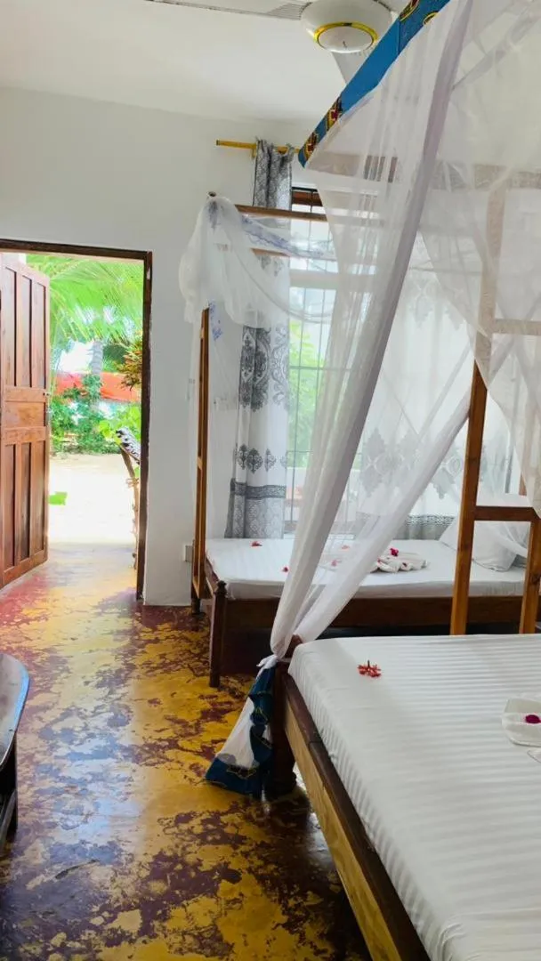 Bed in Sipano Beach Lodge Kiwengwa