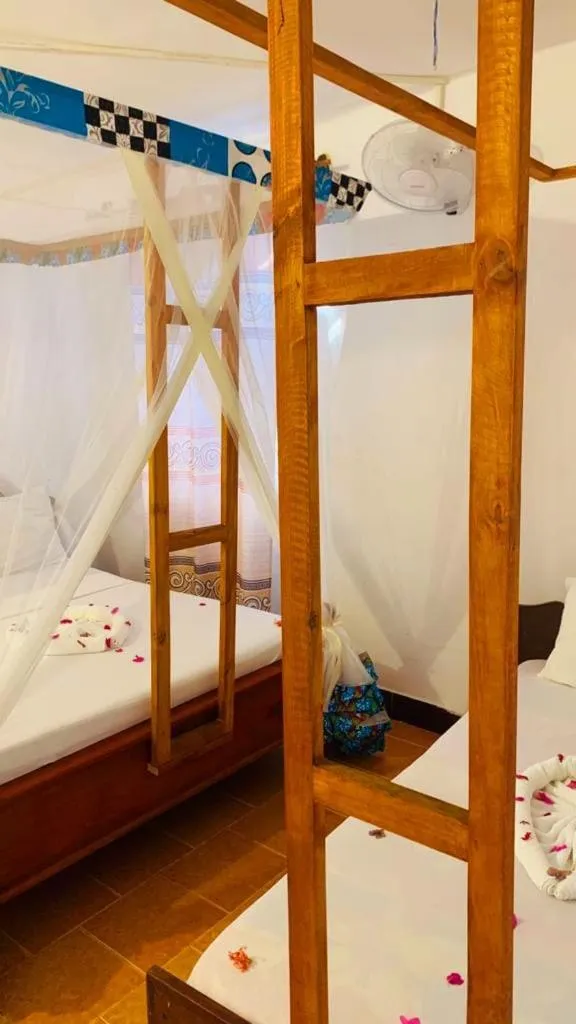 Bed in Sipano Beach Lodge Kiwengwa