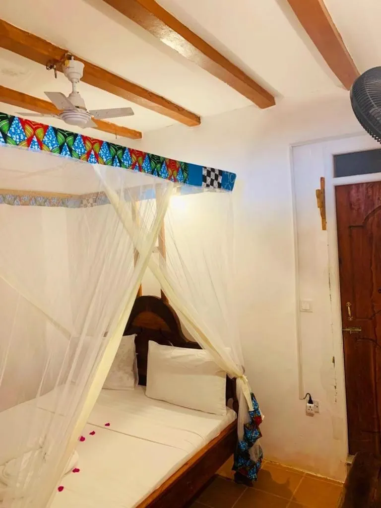 Bed in Sipano Beach Lodge Kiwengwa