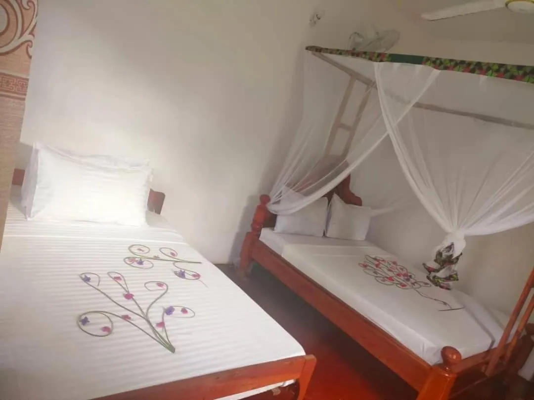 Bed in Sipano Beach Lodge Kiwengwa