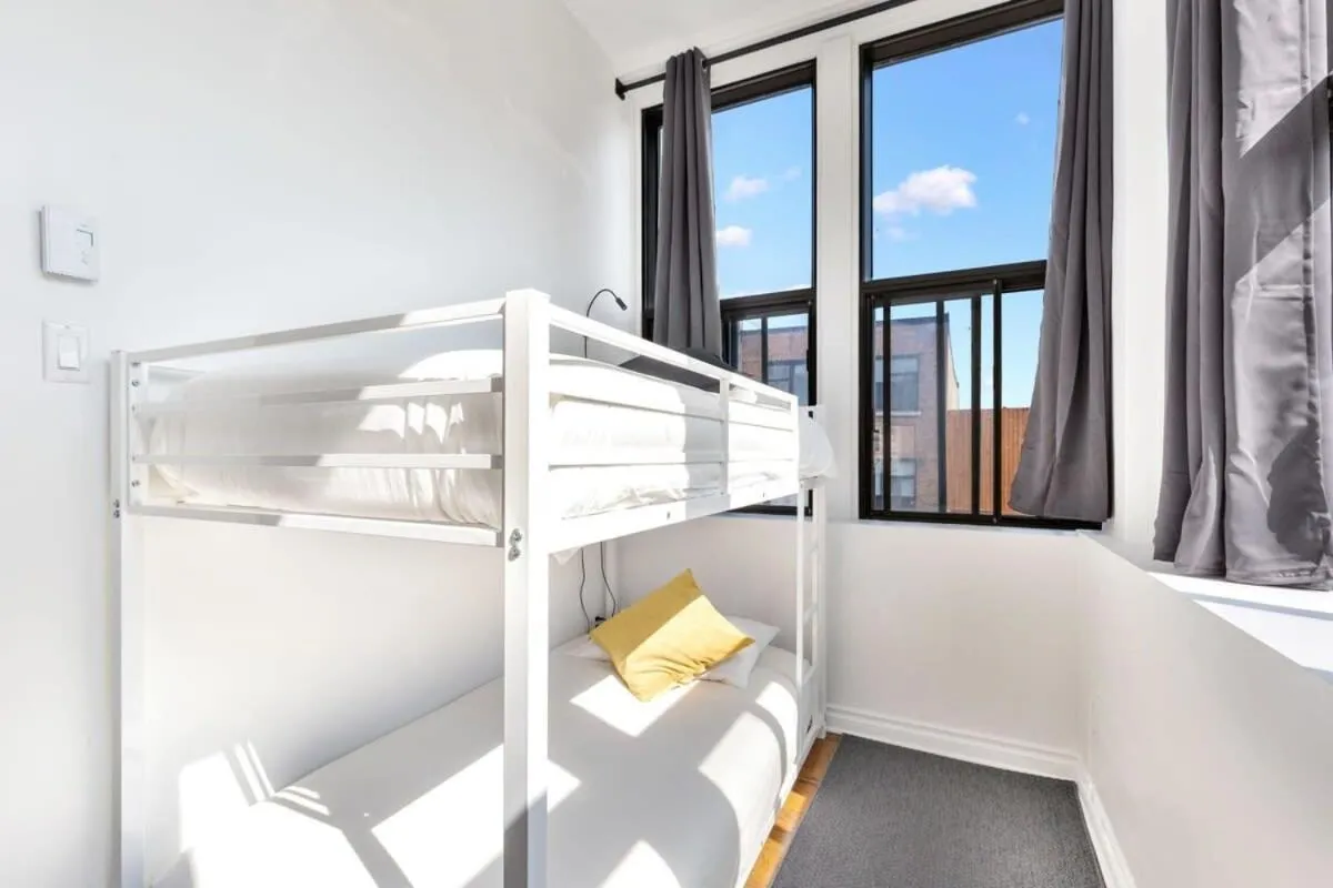 Bed in M11 The Simpsons Suite 3BR in The Heart of MTL