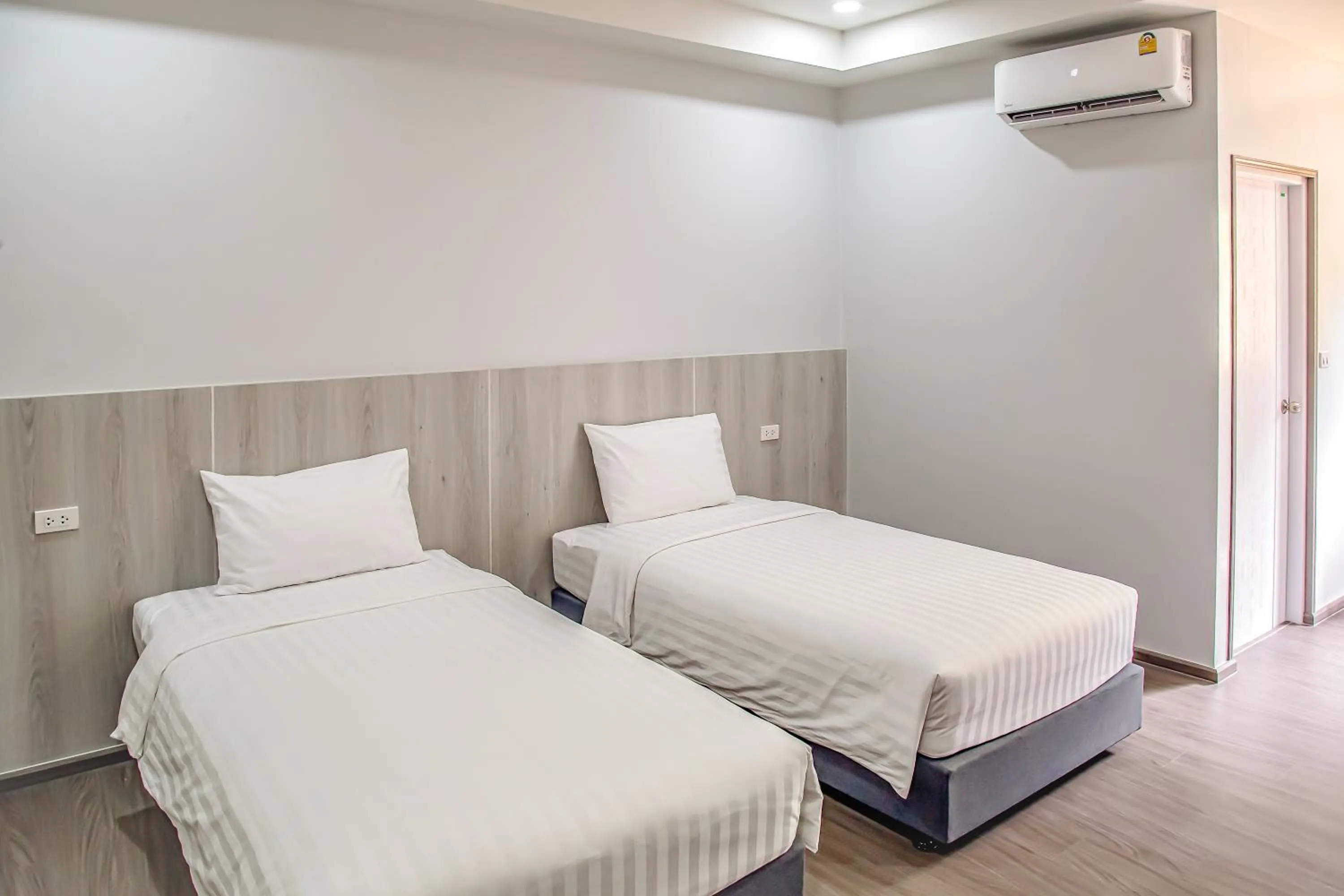 Bed in น่าน ม่วนใจ Nan Muanjai Hotel