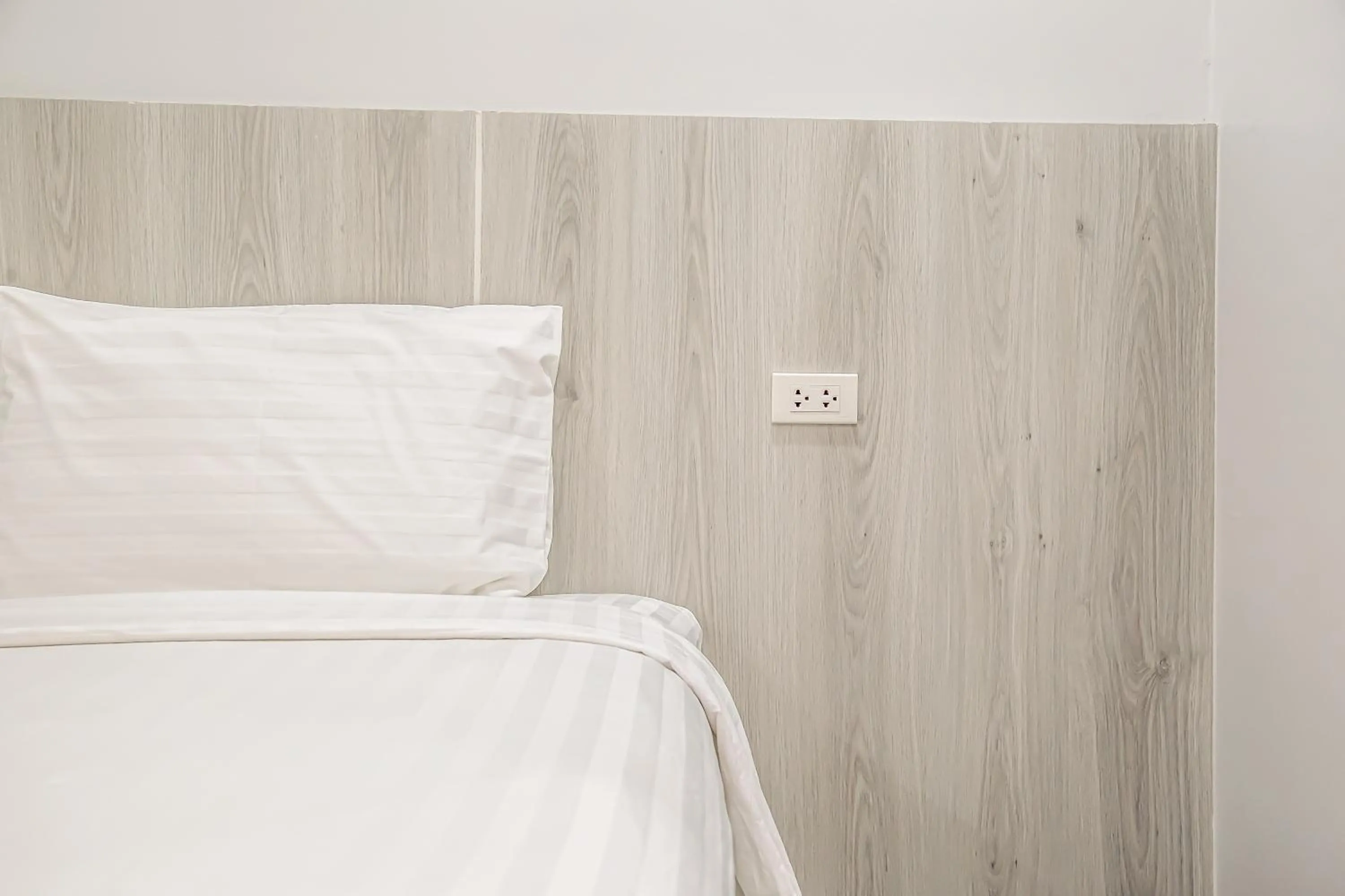 Bed in น่าน ม่วนใจ Nan Muanjai Hotel