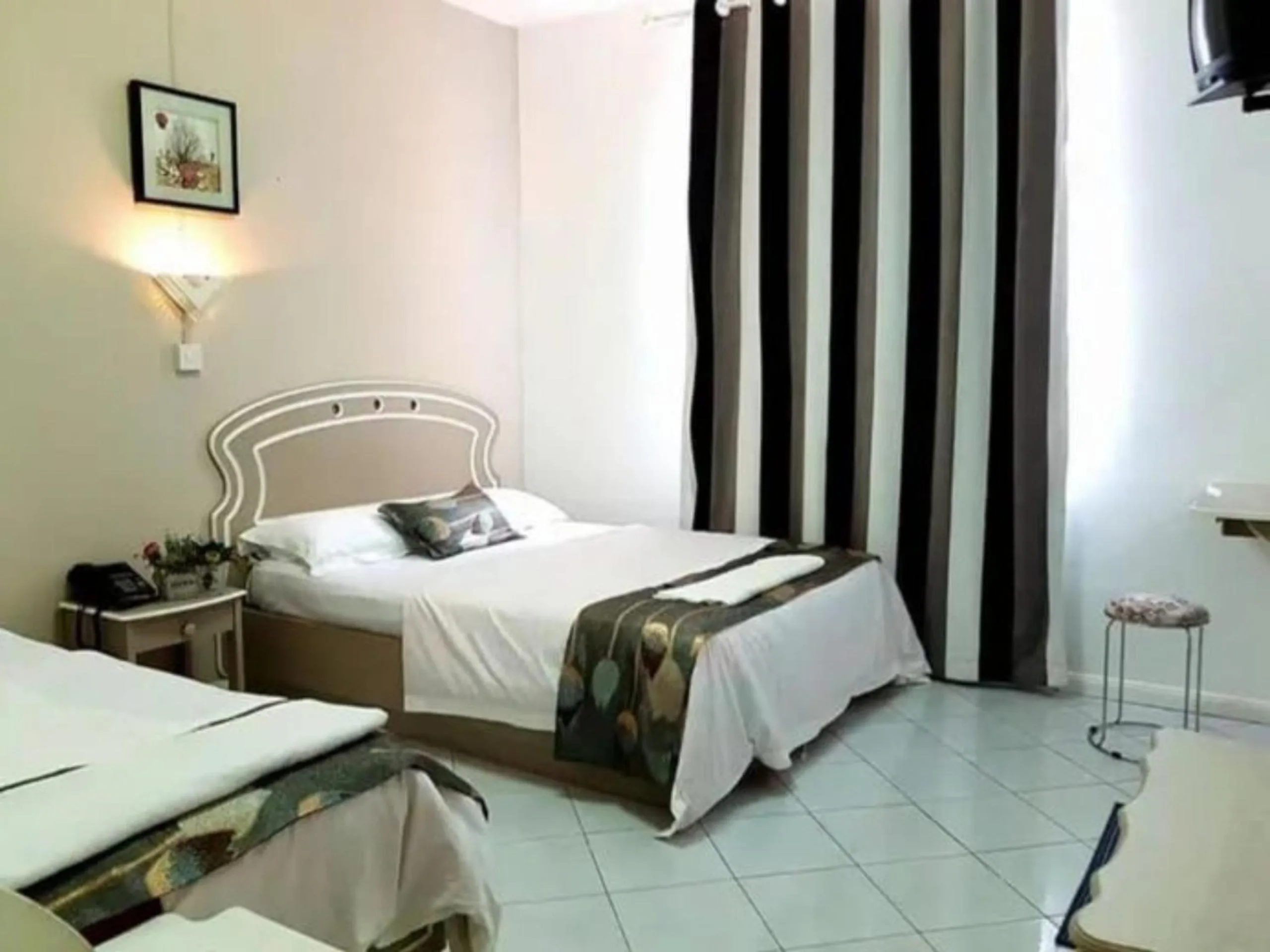 Bed in Euro Vacances Guest House