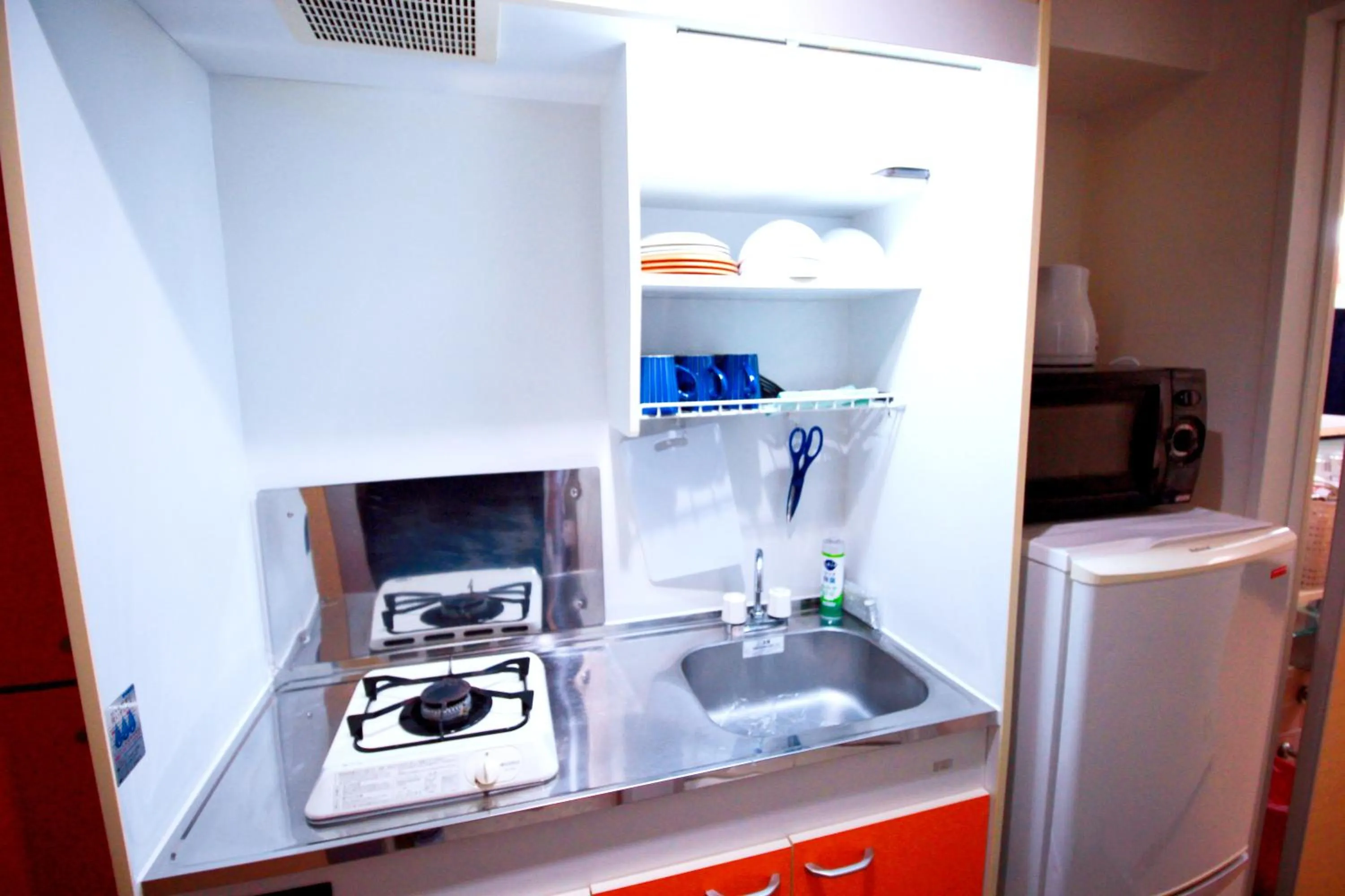 Kitchen or kitchenette in HOTEL AARON通天東