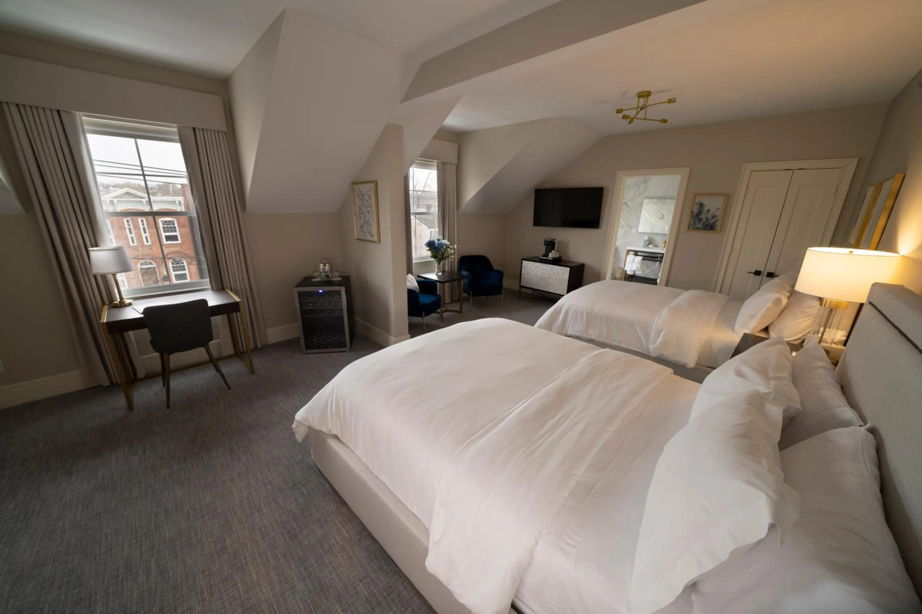 Bed in Orange Inn Boutique Hotel