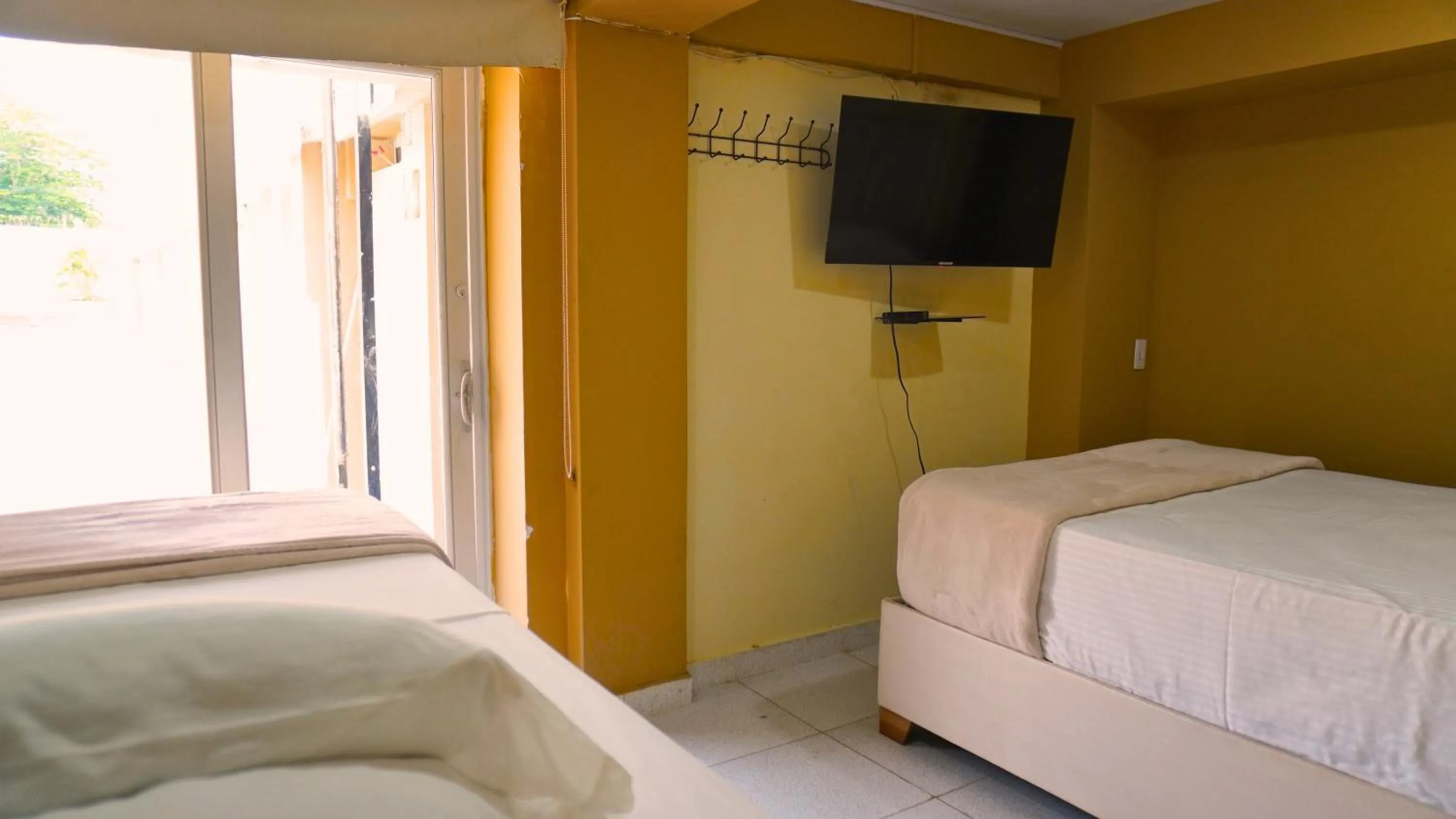 Bedroom in Hotel y Cabañas Covemar