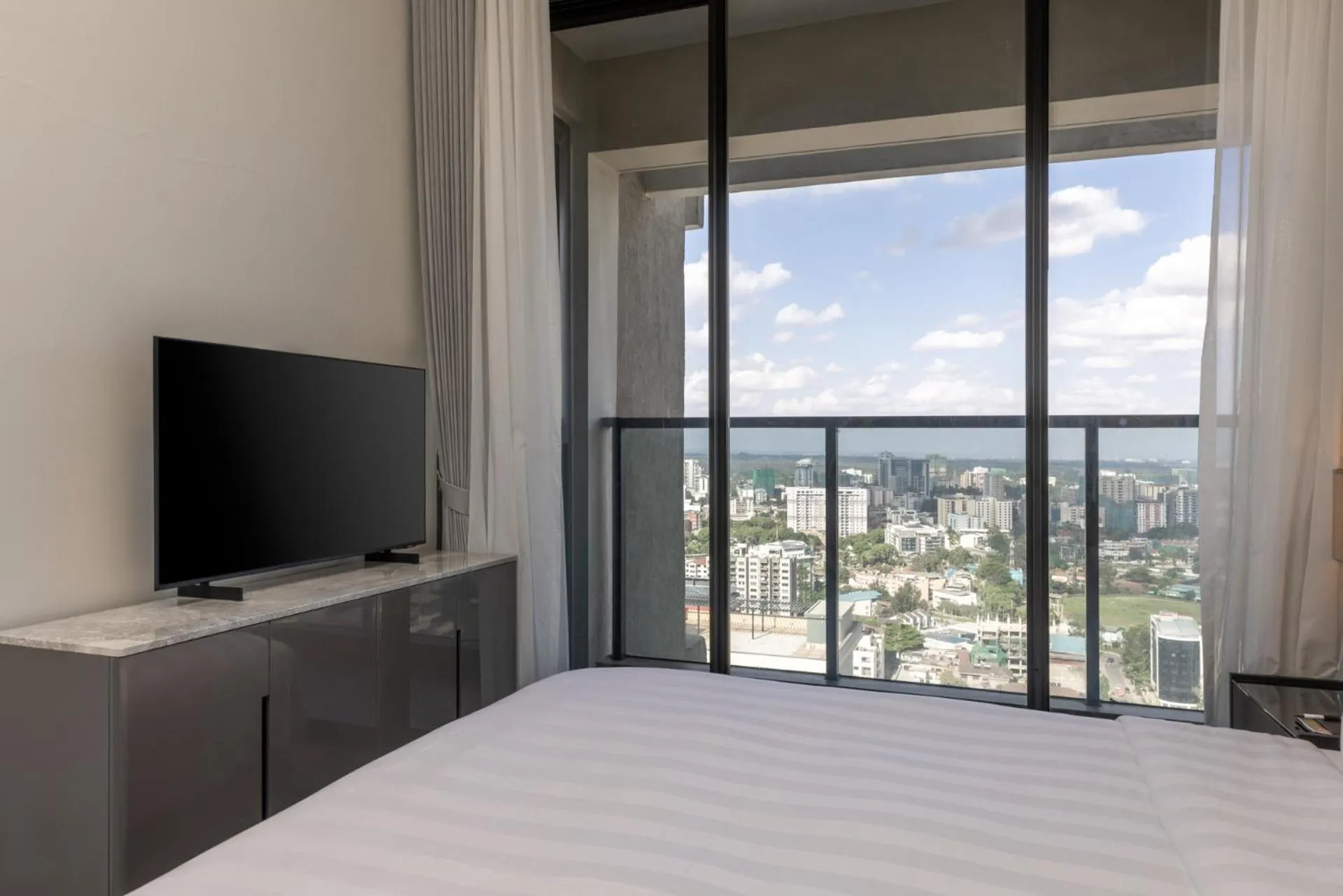 TV and multimedia, Bed in Pan Pacific Serviced Suites Nairobi