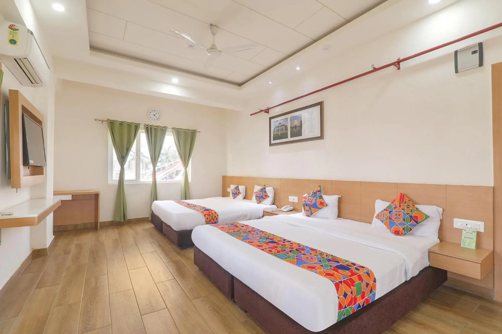 Bed in FabHotel Raghubar Kripa